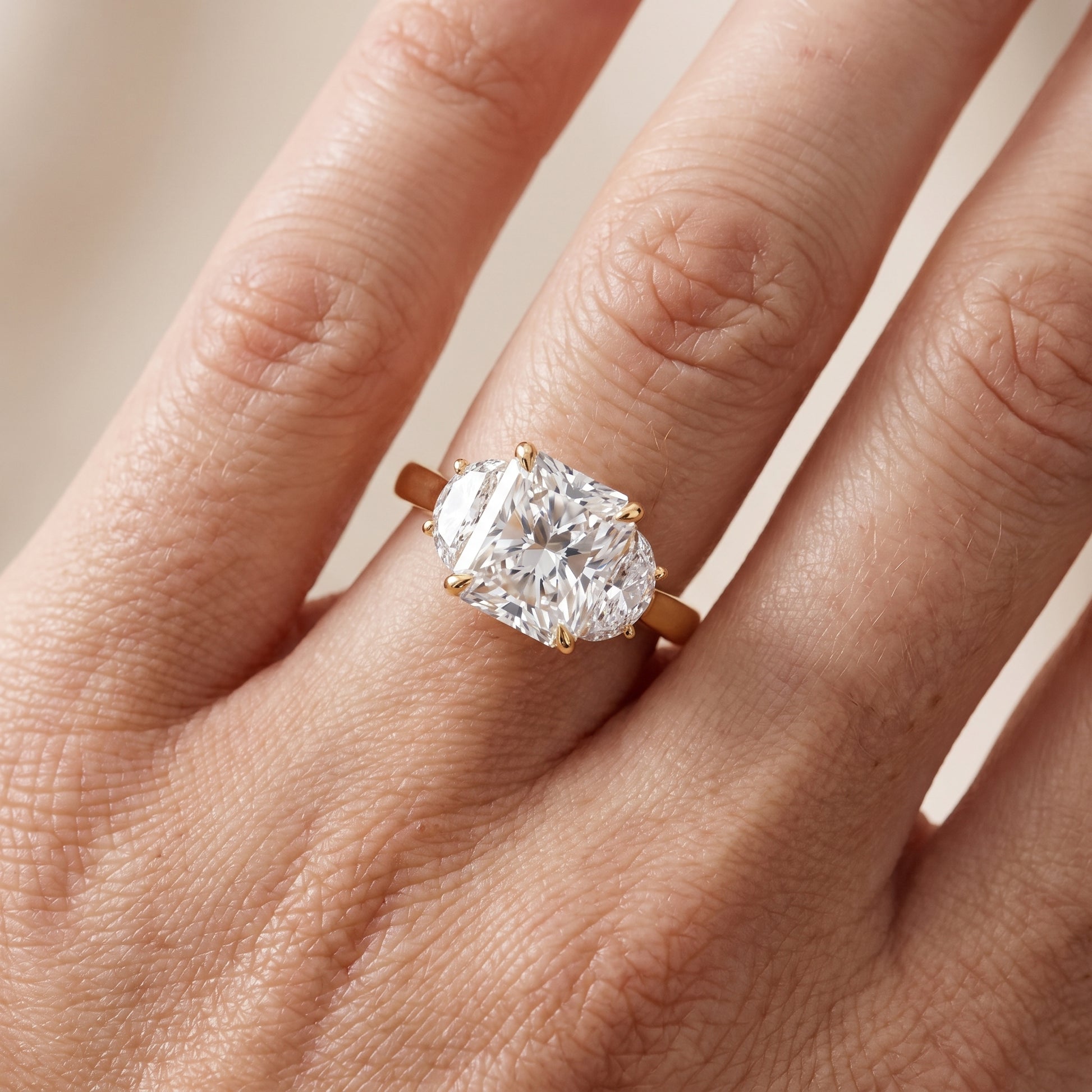 Romy Three-Stone Radiant Diamond Engagement Ring in Yellow Gold - lifestyle.jpg