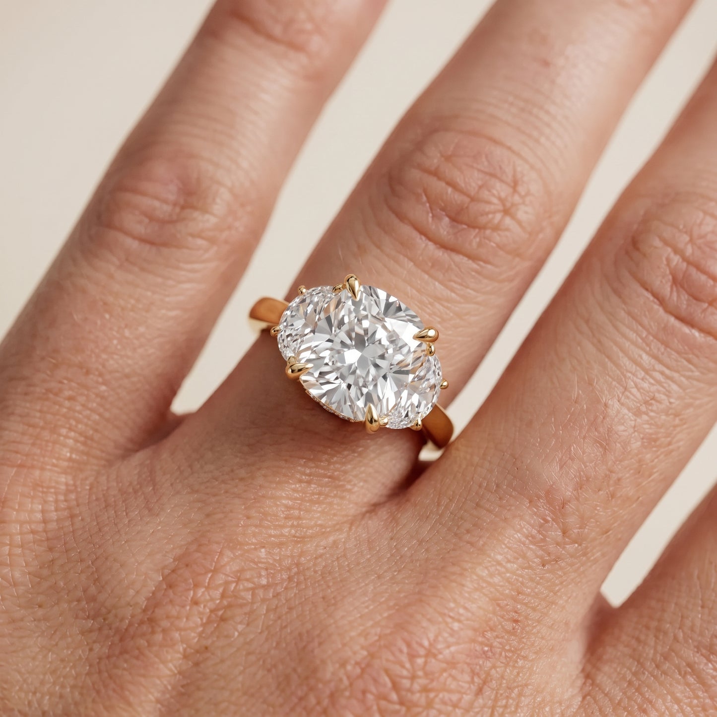 Romy Three-Stone Cushion Diamond Engagement Ring in Yellow Gold - lifestyle.jpg