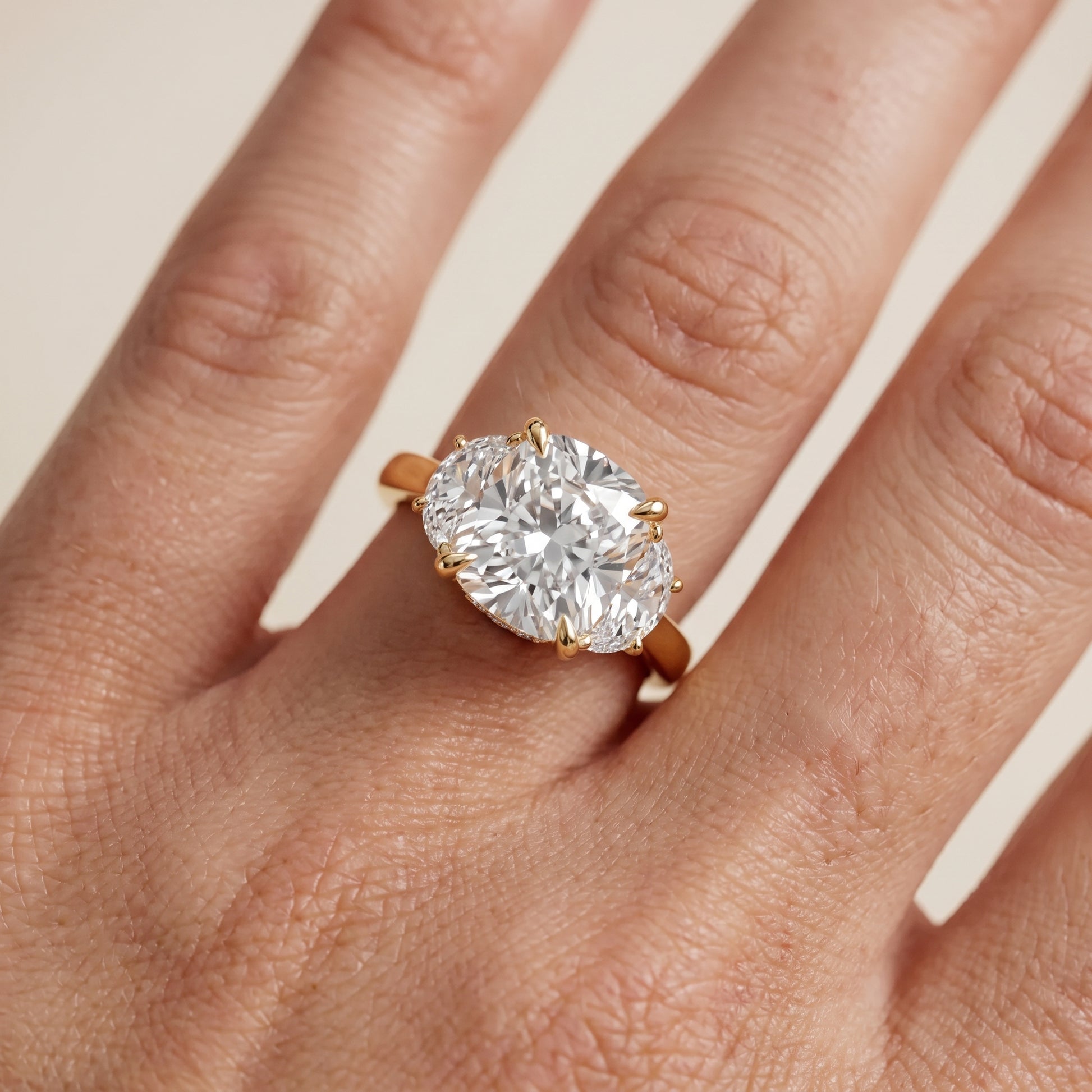 Romy Three-Stone Cushion Diamond Engagement Ring in Yellow Gold - lifestyle.jpg