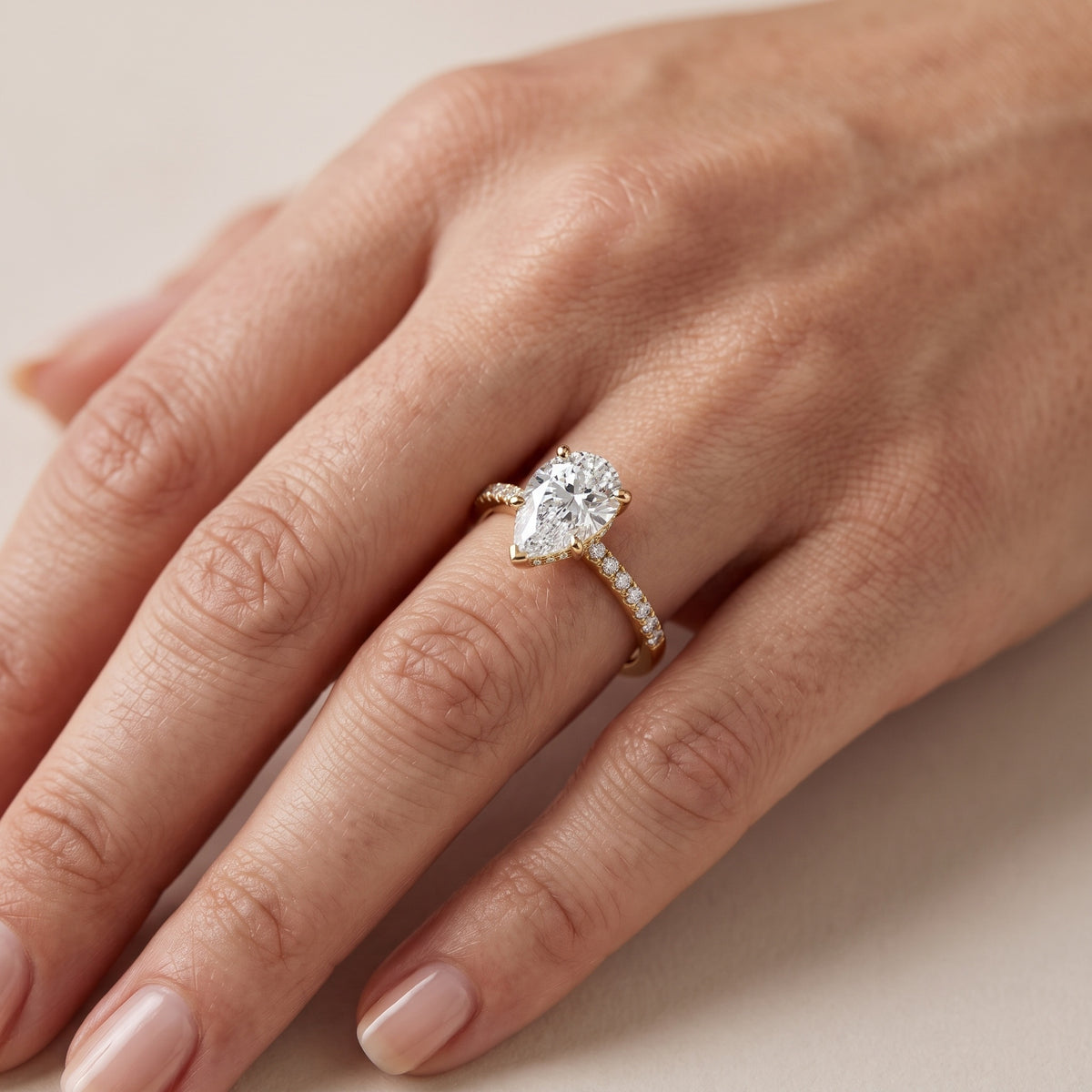 Moab Petal Pavé Pear Diamond Engagement Ring in Platinum - lifestyle.jpg