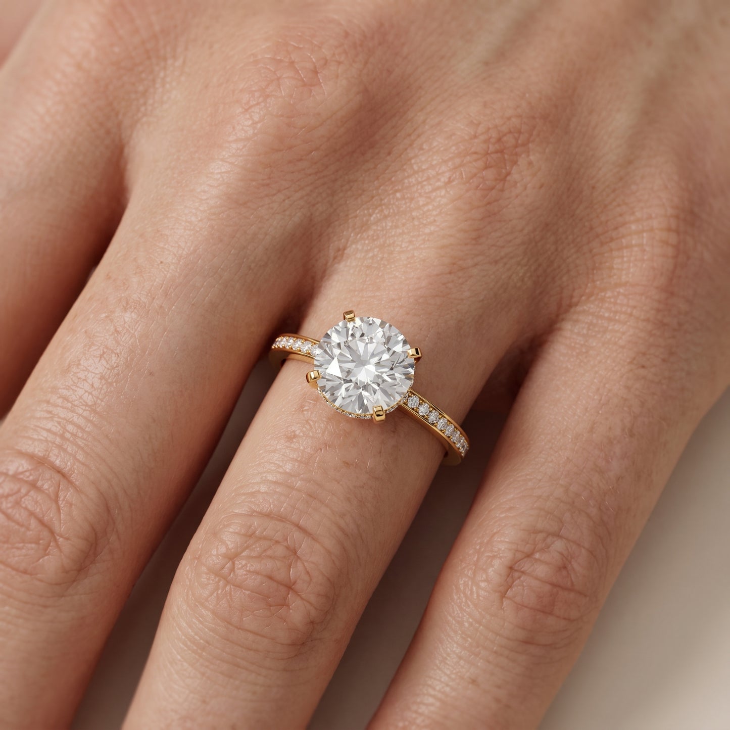 Naia Hidden Halo Round Diamond Ring in Yellow Gold - lifestyle.jpg