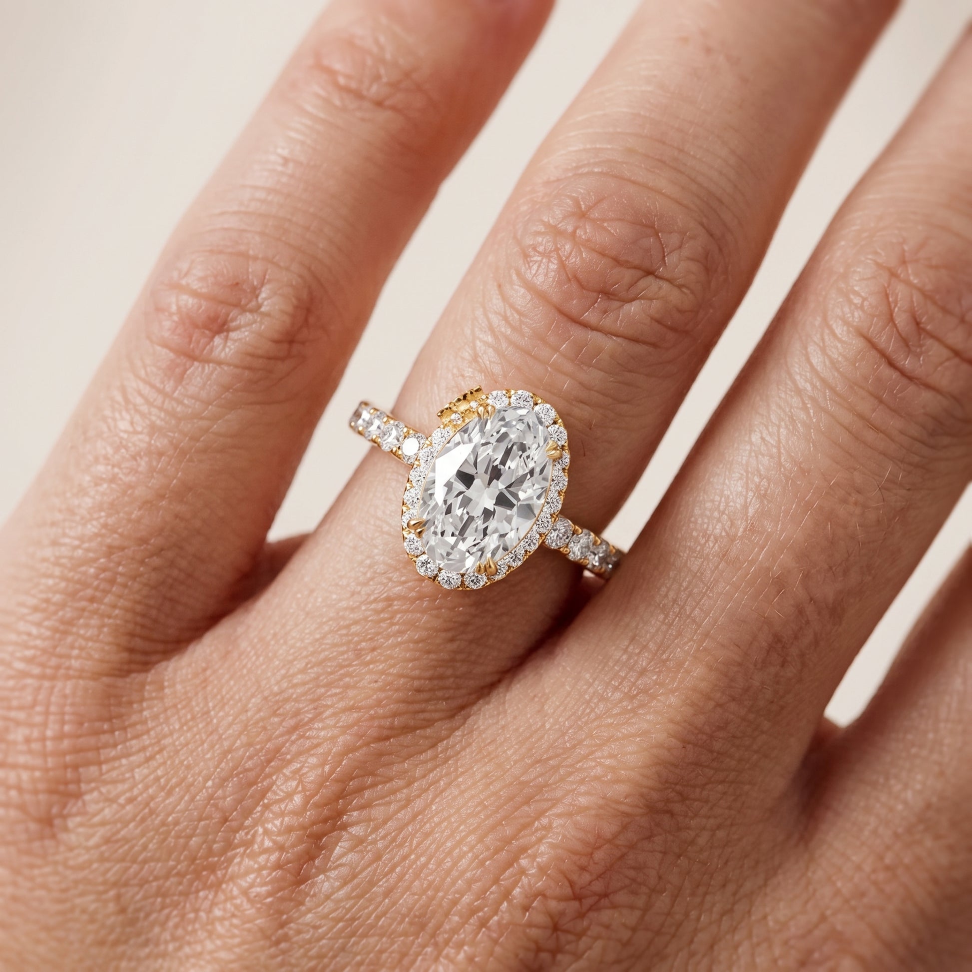 Chloe Halo Pavé Oval Diamond Ring in Yellow Gold - lifestyle.jpg