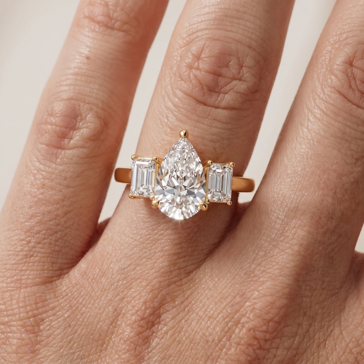Zoe Three-Stone Pear Diamond Ring in Yellow Gold - lifestyle.jpg
