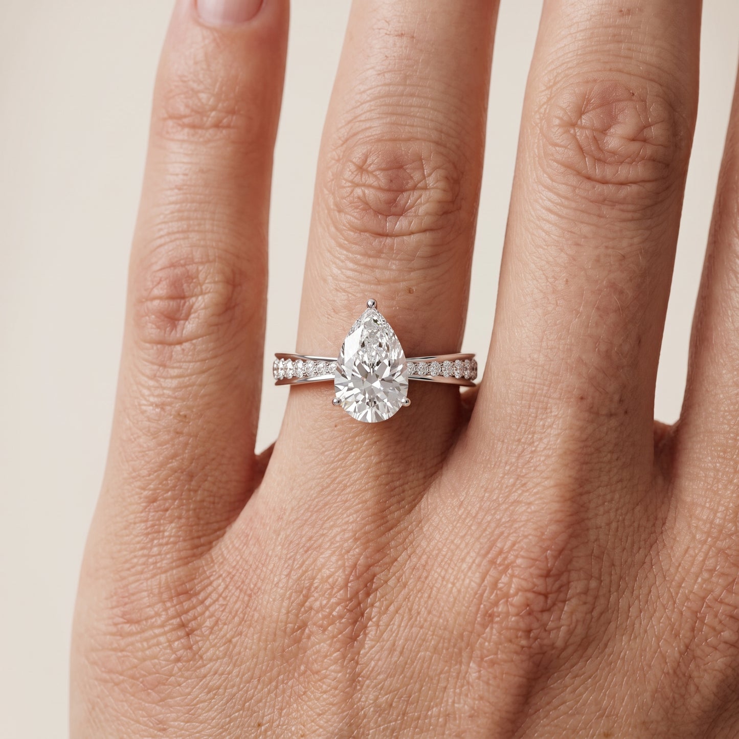 Rhea Sidestone Pavé Pear Diamond Engagement Ring in White Gold - lifestyle.jpg