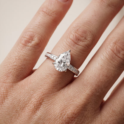 Maren Sidestone Channel Set Pear Diamond Engagement Ring in White Gold - lifestyle.jpg
