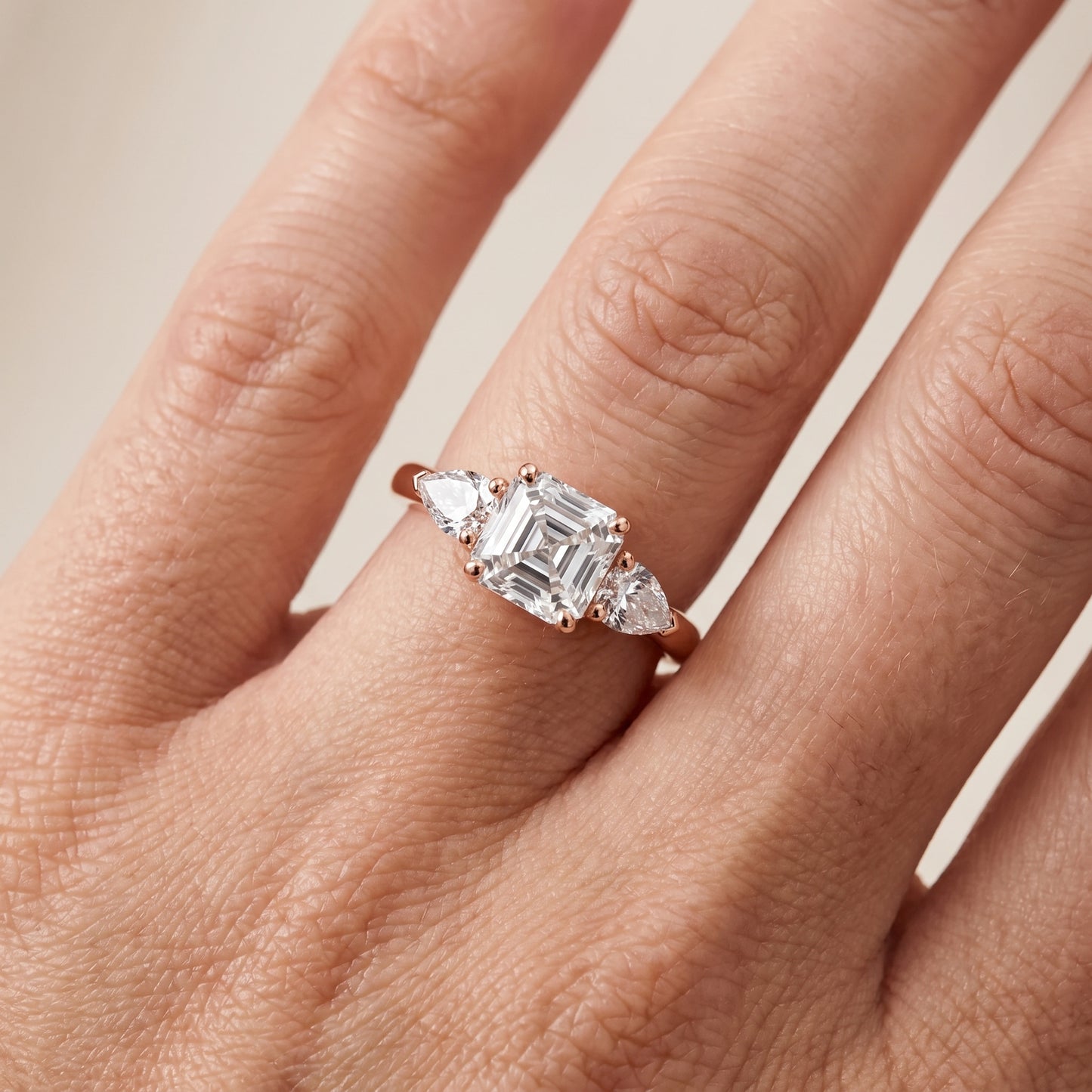 Mirabel Three-Stone Asscher Diamond Engagement Ring in Rose Gold - lifestyle.jpg