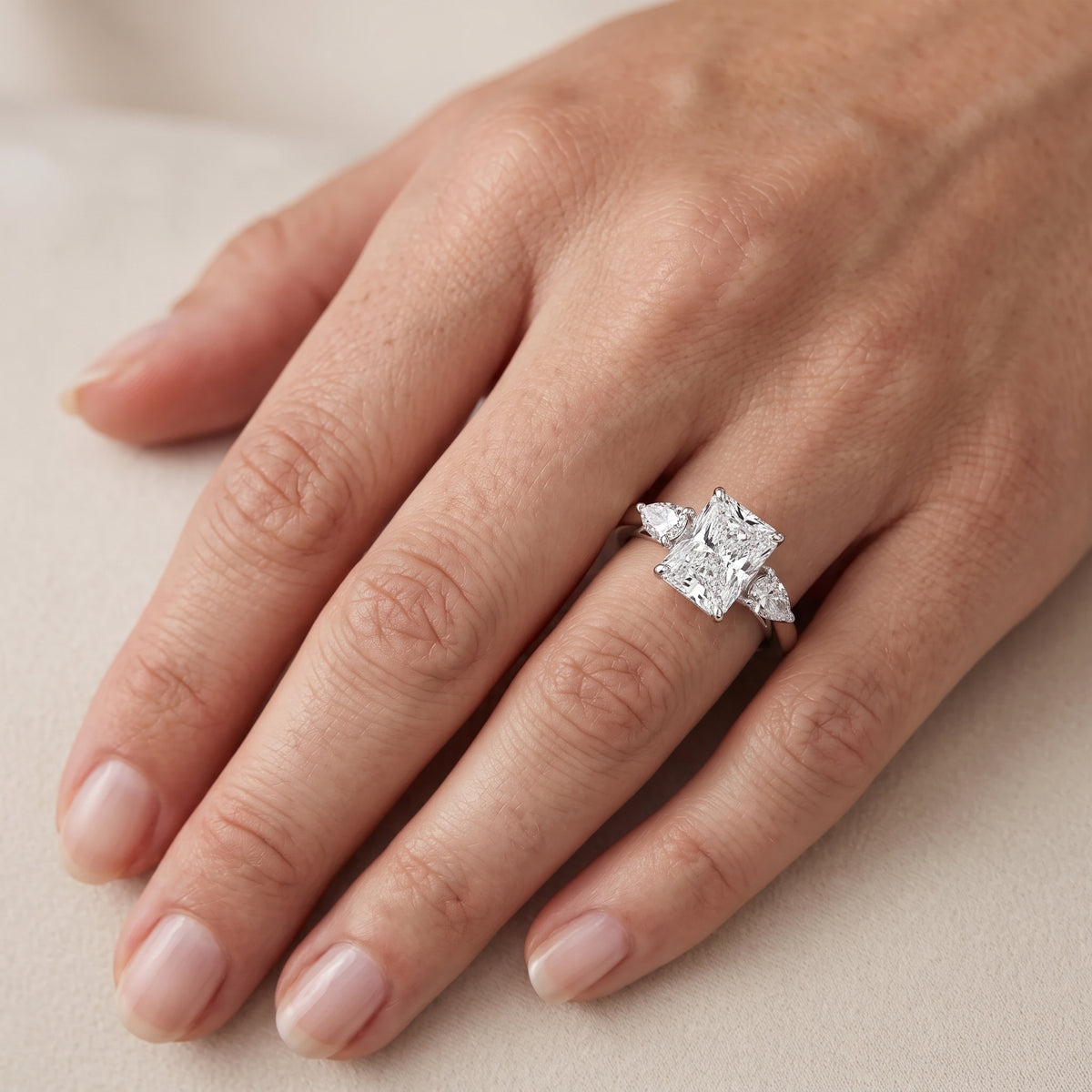 Stella Three-Stone Radiant Diamond Engagement Ring in Platinum - lifestyle.jpg