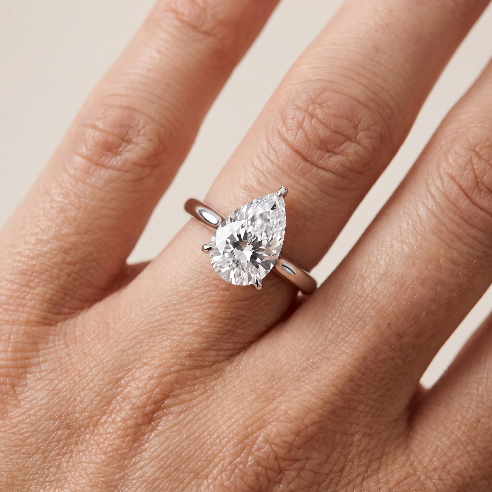 Evie Solitaire Six-Prong Pear Diamond Engagement Ring in White Gold - lifestyle.jpg