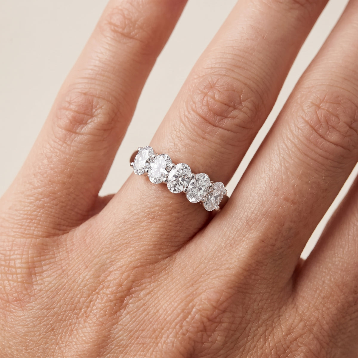 Estela Shared Prong Oval Diamond Wedding Band in White Gold - lifestyle.jpg