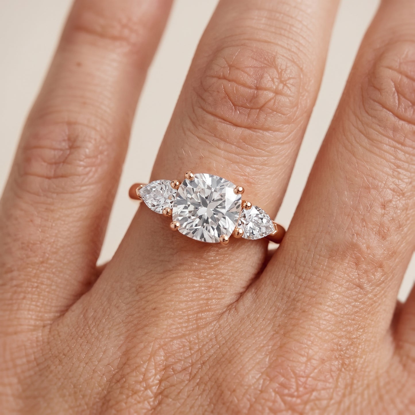 Mirabel Three-Stone Cushion Diamond Engagement Ring in Rose Gold - lifestyle.jpg