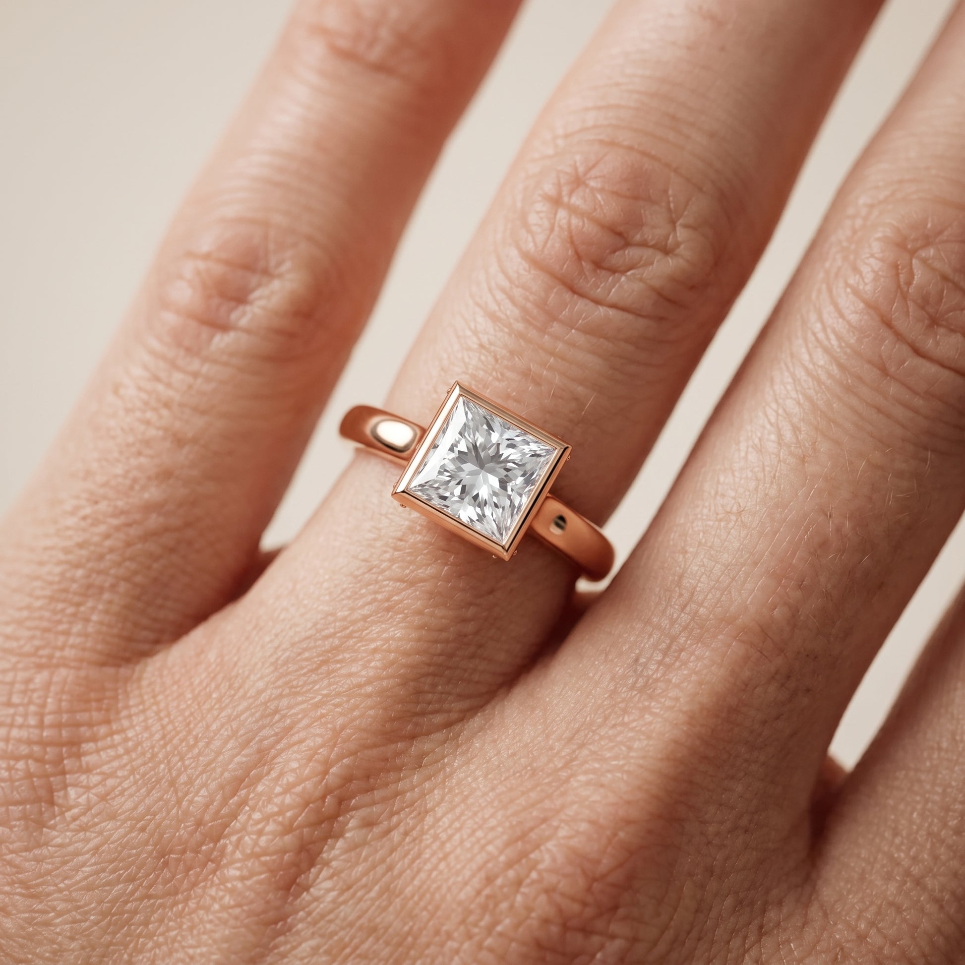 Jolie Bezel Solitaire Princess Diamond Engagement Ring in Rose Gold - lifestyle.jpg