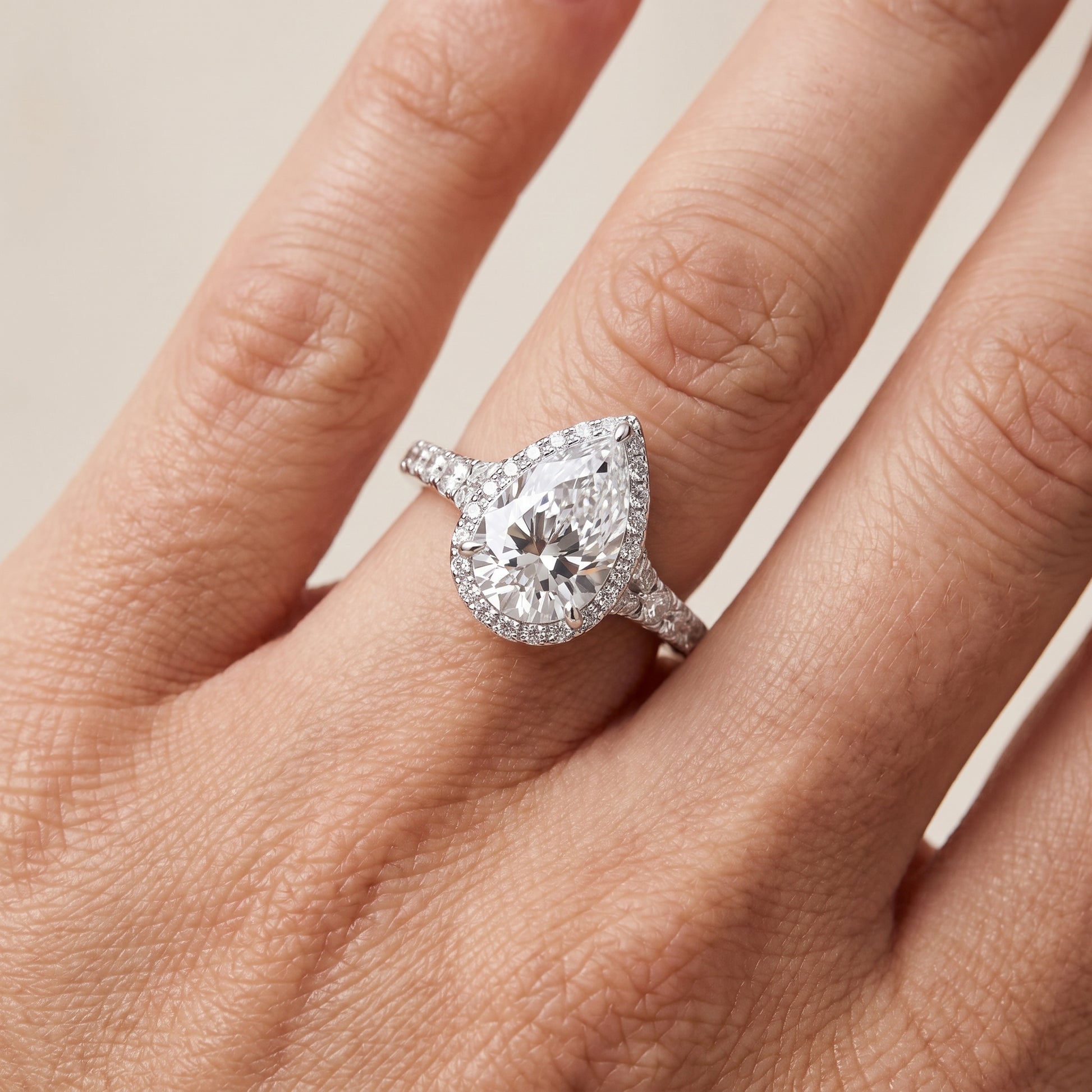 Bella Halo Pavé Pear Diamond Engagement Ring in Silver - lifestyle.jpg