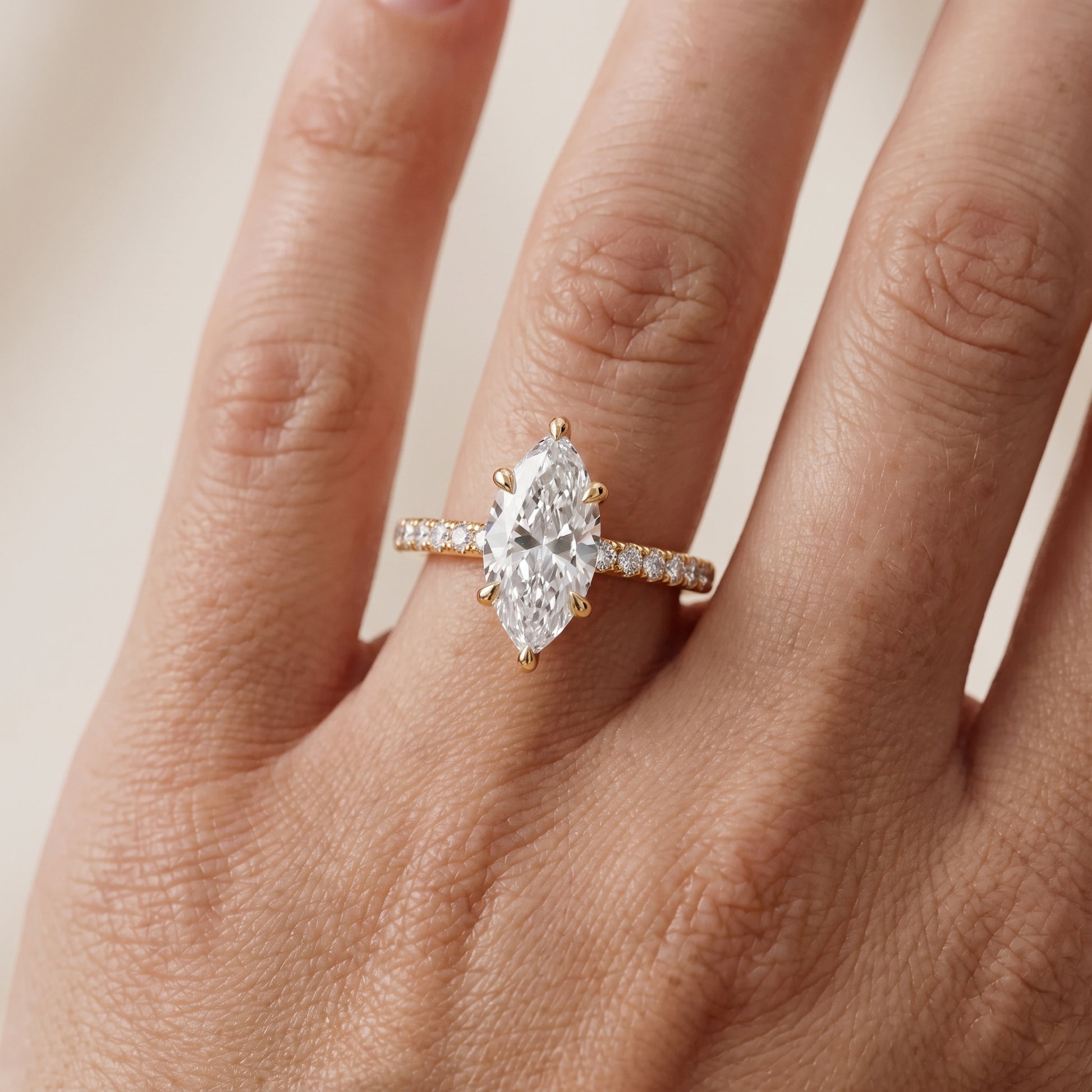 Maya Hidden Halo Pavé Marquise Diamond Engagement Ring in Yellow Gold - lifestyle.jpg