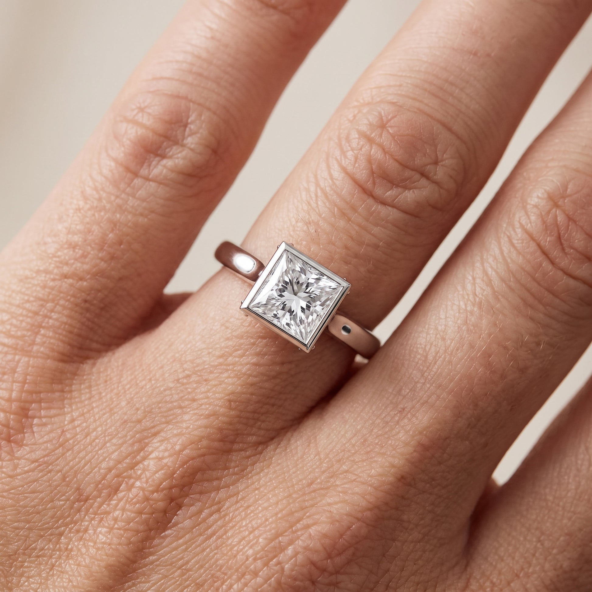 Jolie Bezel Solitaire Princess Diamond Engagement Ring in Platinum - lifestyle.jpg