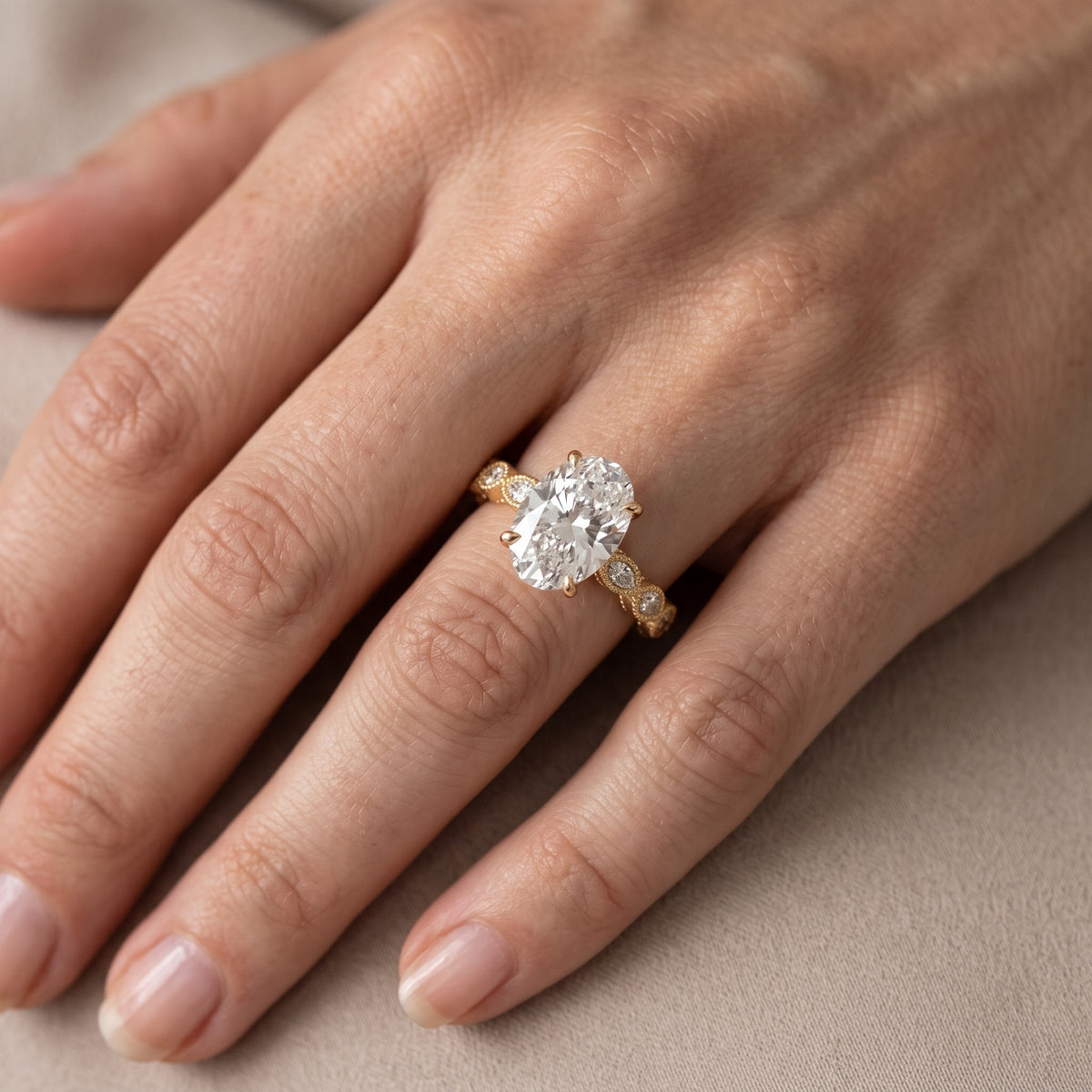 Freya Milgrain Leaf Oval Diamond Engagement Ring in Yellow Gold - lifestyle.jpg