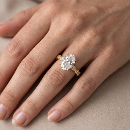 Freya Milgrain Leaf Oval Diamond Engagement Ring in Yellow Gold - lifestyle.jpg