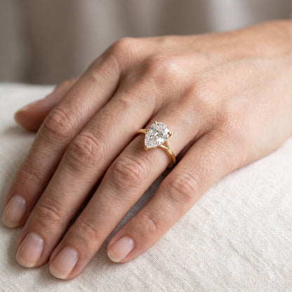 Blanche Solitaire Split Shank Pear Diamond Engagement Ring in Platinum - lifestyle.jpg