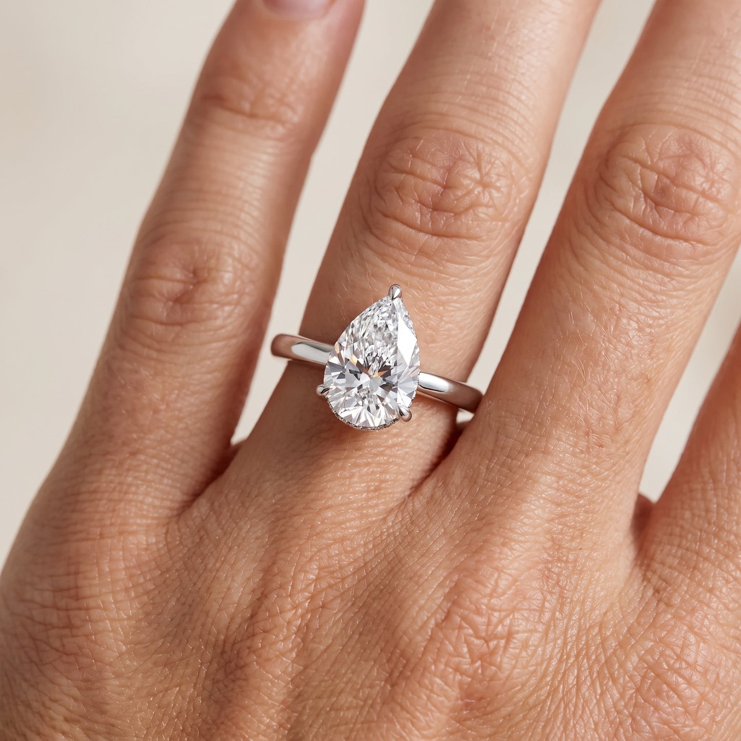 Mena Hidden Halo Pear Diamond Engagement Ring in Silver - lifestyle.jpg