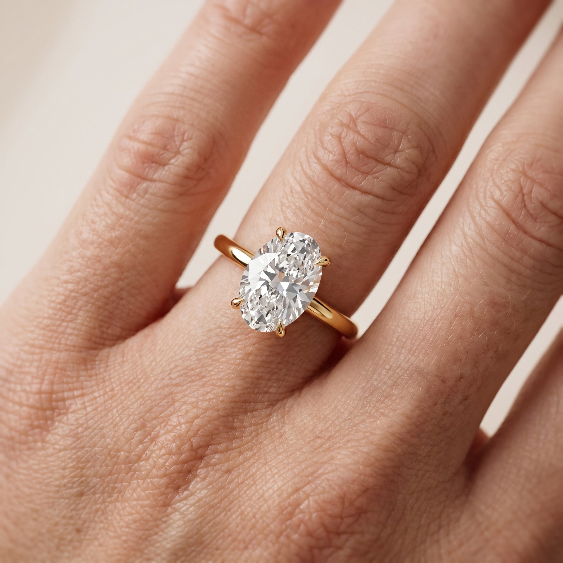Lyla Petite Solitaire Oval Diamond Engagement Ring in Yellow Gold - lifestyle.jpg
