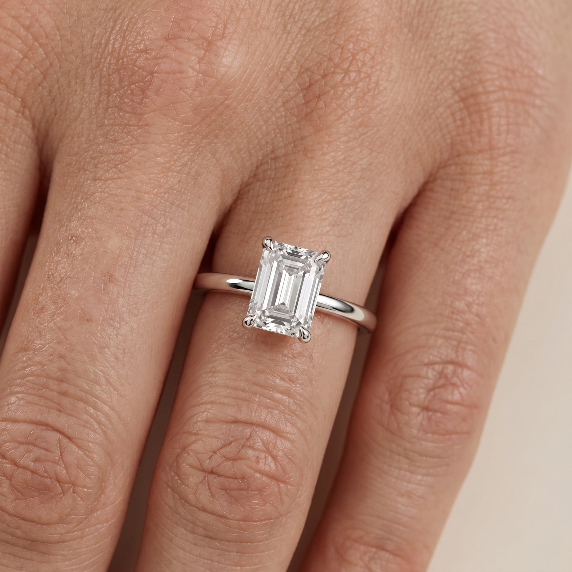 Nella Petite Solitaire Emerald Diamond Engagement Ring in White Gold - lifestyle.jpg