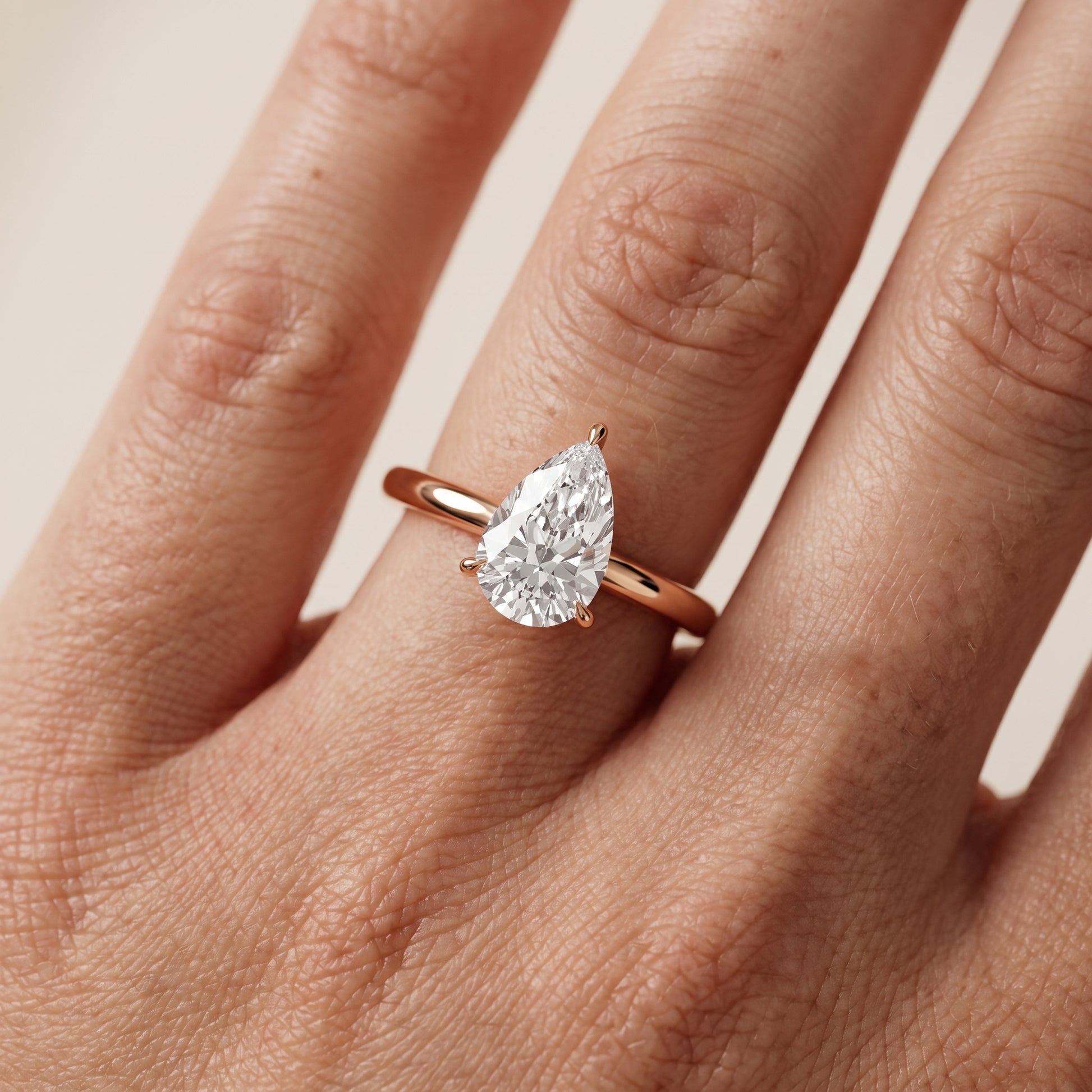Lyla Petite Solitaire Pear Diamond Engagement Ring in Rose Gold - lifestyle.jpg