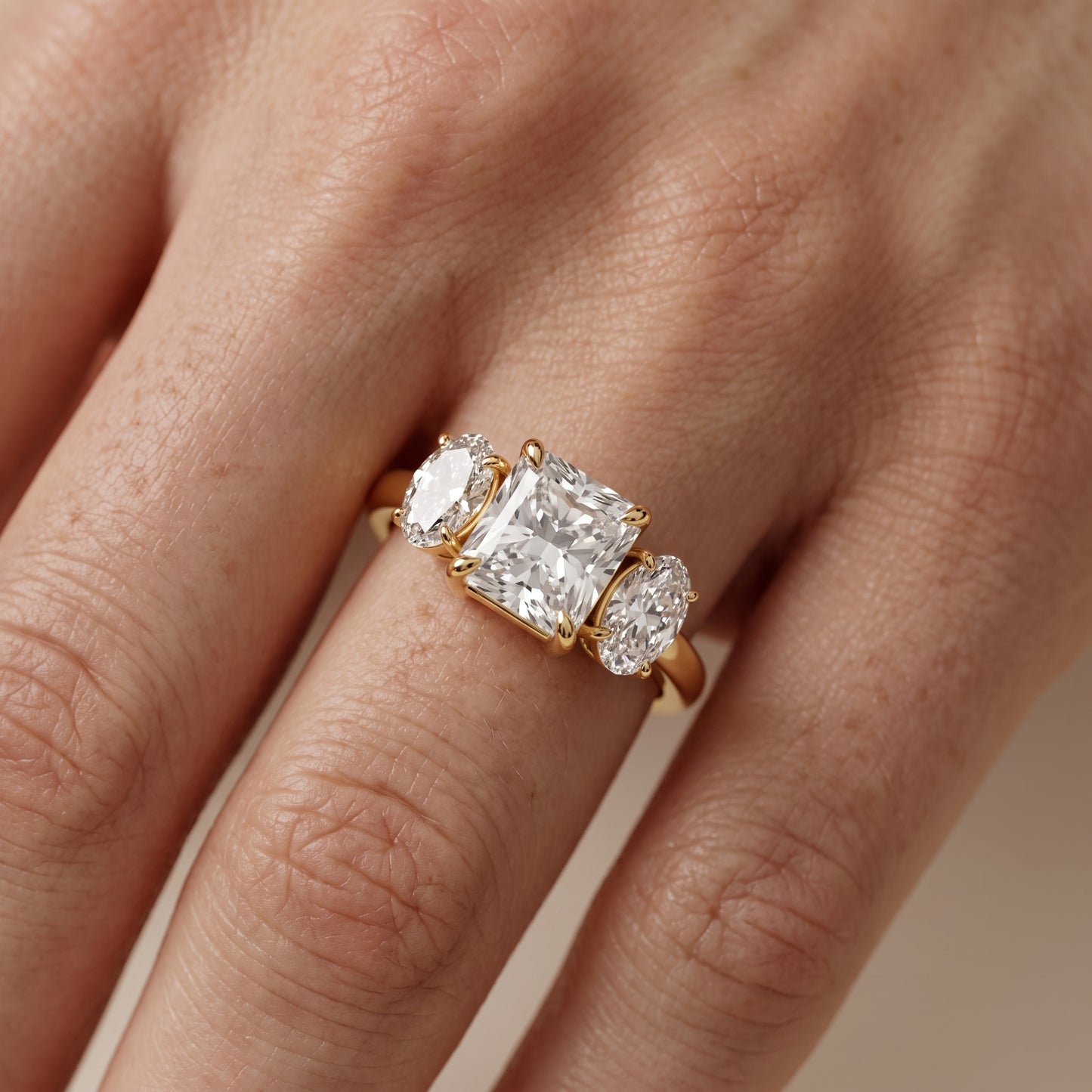Lila Three-Stone Radiant Diamond Ring in Yellow Gold - lifestyle.jpg