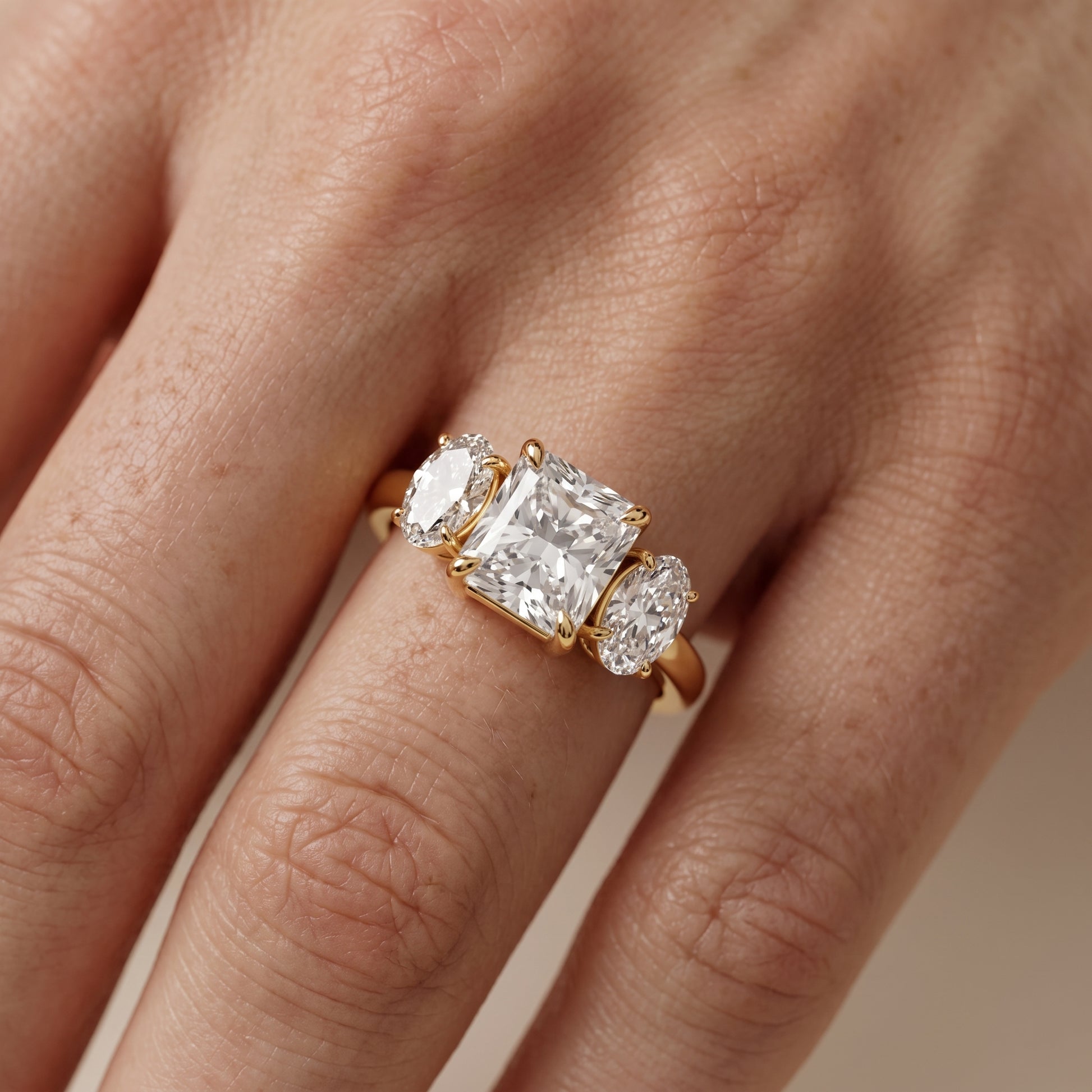 Lila Three-Stone Radiant Diamond Ring in Yellow Gold - lifestyle.jpg