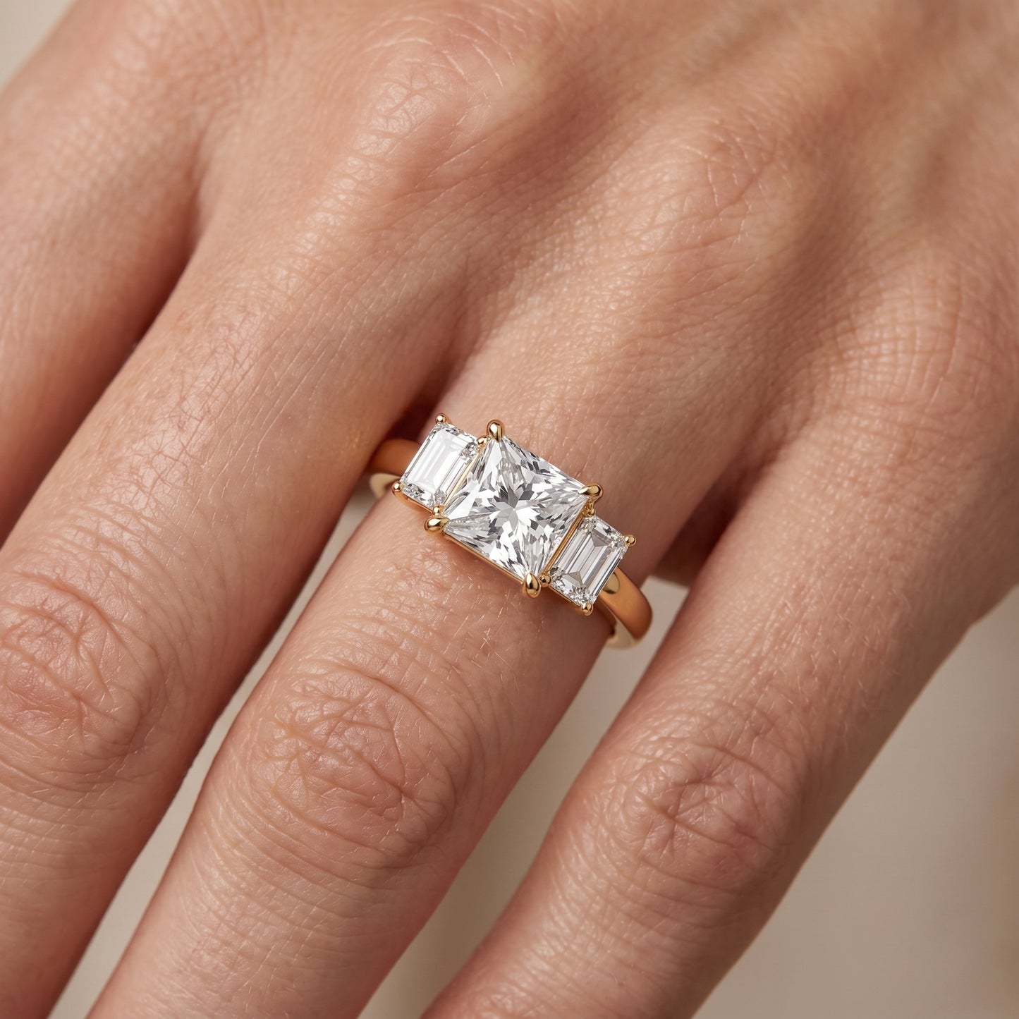 Zoe Three-Stone Princess Diamond Ring in Yellow Gold - lifestyle.jpg