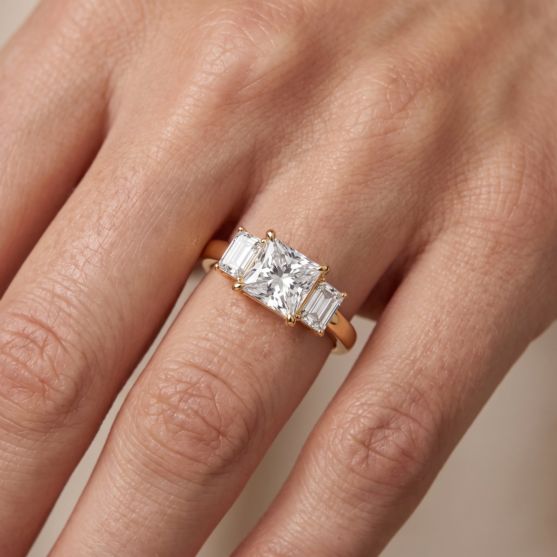 Zoe Three-Stone Princess Diamond Ring in Yellow Gold - lifestyle.jpg