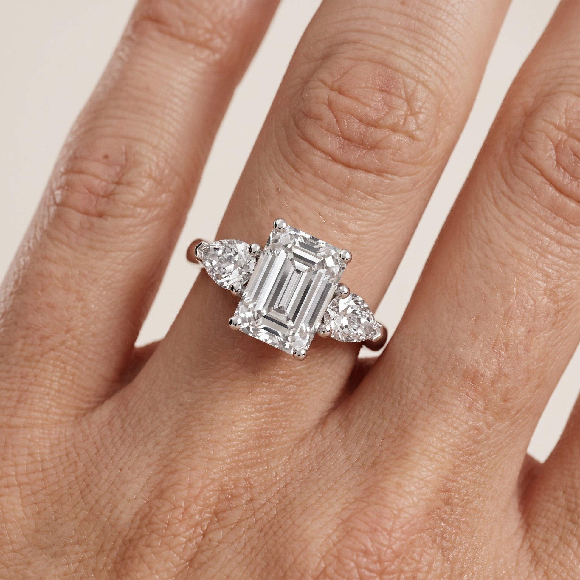Mirabel Three-Stone Emerald Diamond Engagement Ring in Platinum - lifestyle.jpg