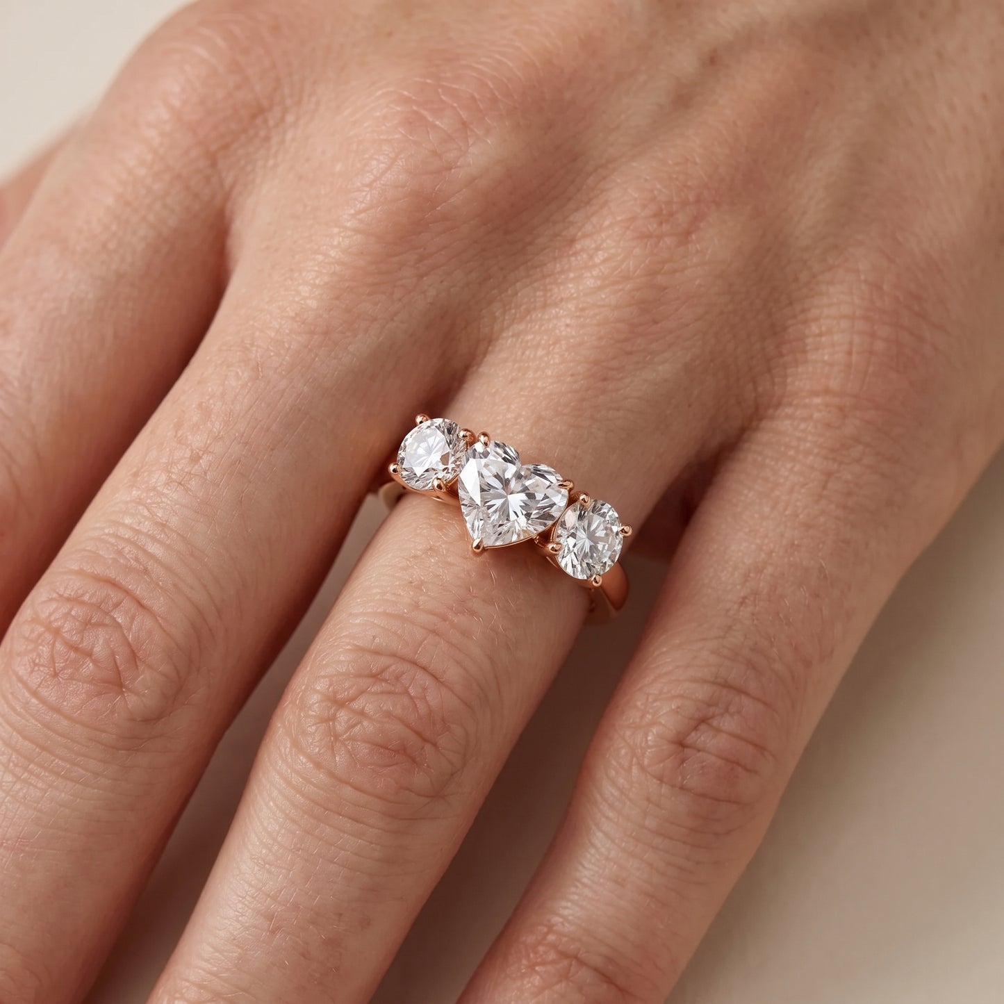 Esme Three-Stone Tapered Heart Diamond Ring in Rose Gold - lifestyle.jpg
