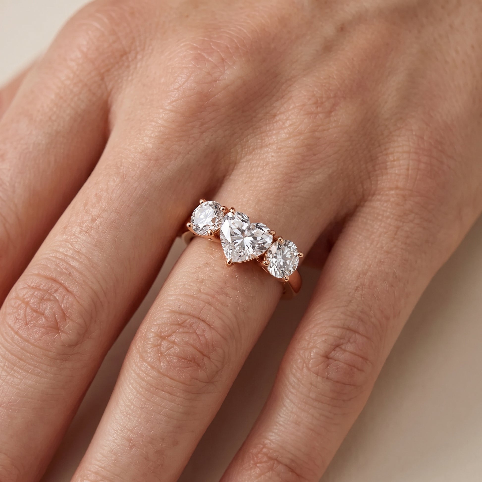 Esme Three-Stone Tapered Heart Diamond Ring in Rose Gold - lifestyle.jpg