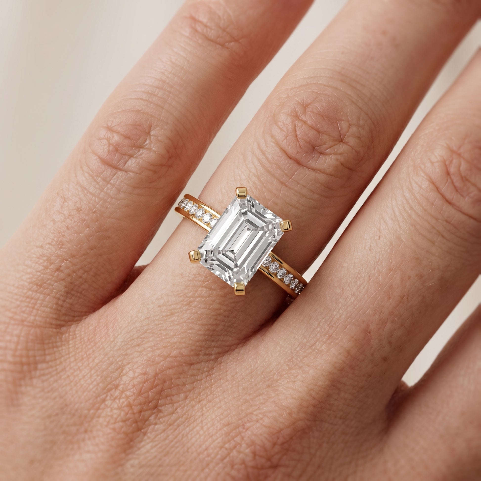 Tessa Solitaire Channel Set Emerald Diamond Engagement Ring in Yellow Gold - lifestyle.jpg