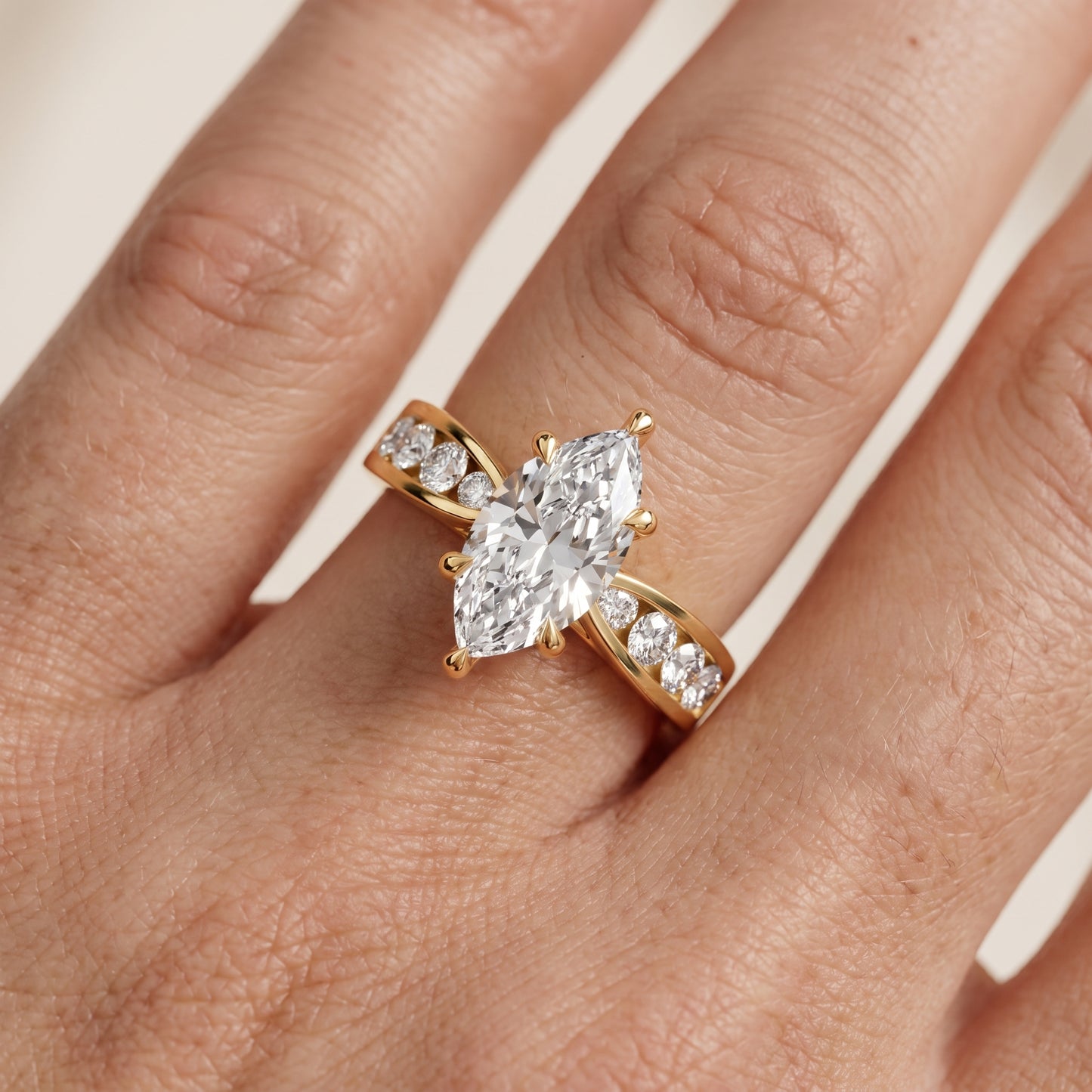 Noor Channel Set Sidestone Marquise Diamond Engagement Ring in Yellow Gold - lifestyle.jpg