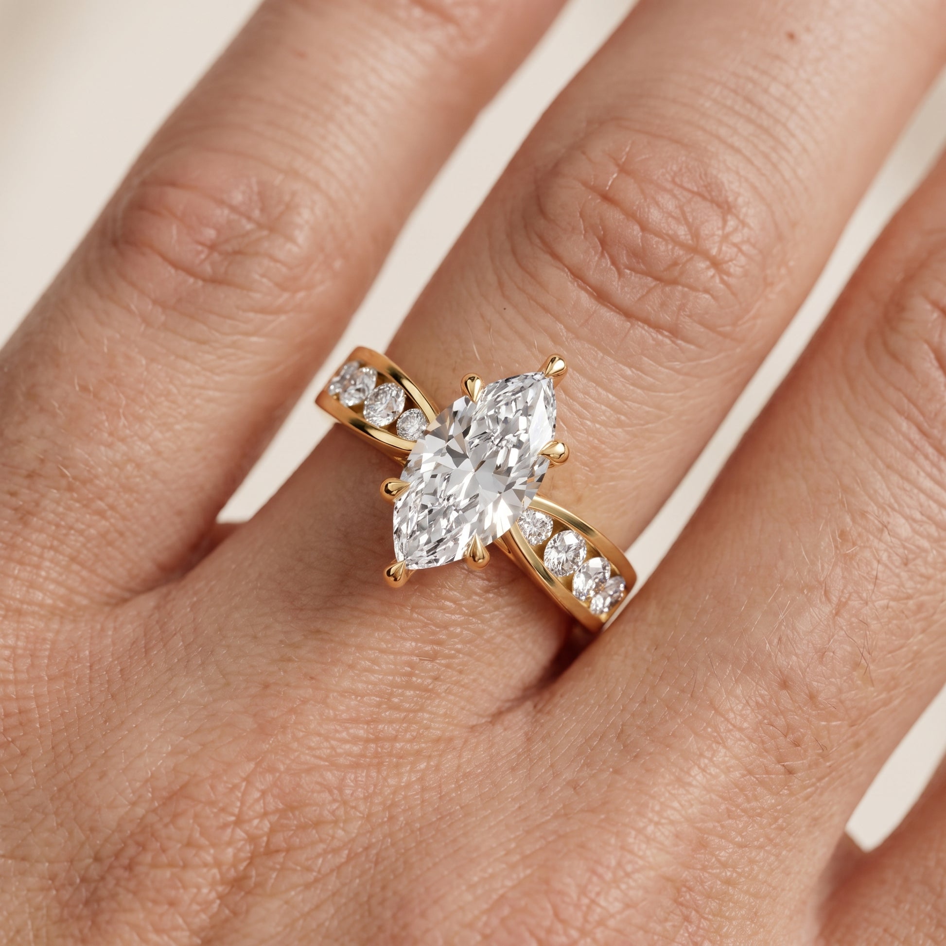 Noor Channel Set Sidestone Marquise Diamond Engagement Ring in Yellow Gold - lifestyle.jpg