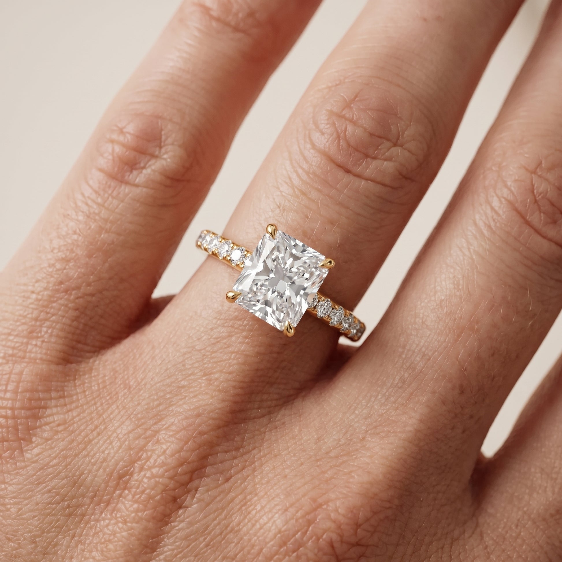 Thea Hidden Halo Pavé Radiant Diamond Engagement Ring in Yellow Gold - lifestyle.jpg