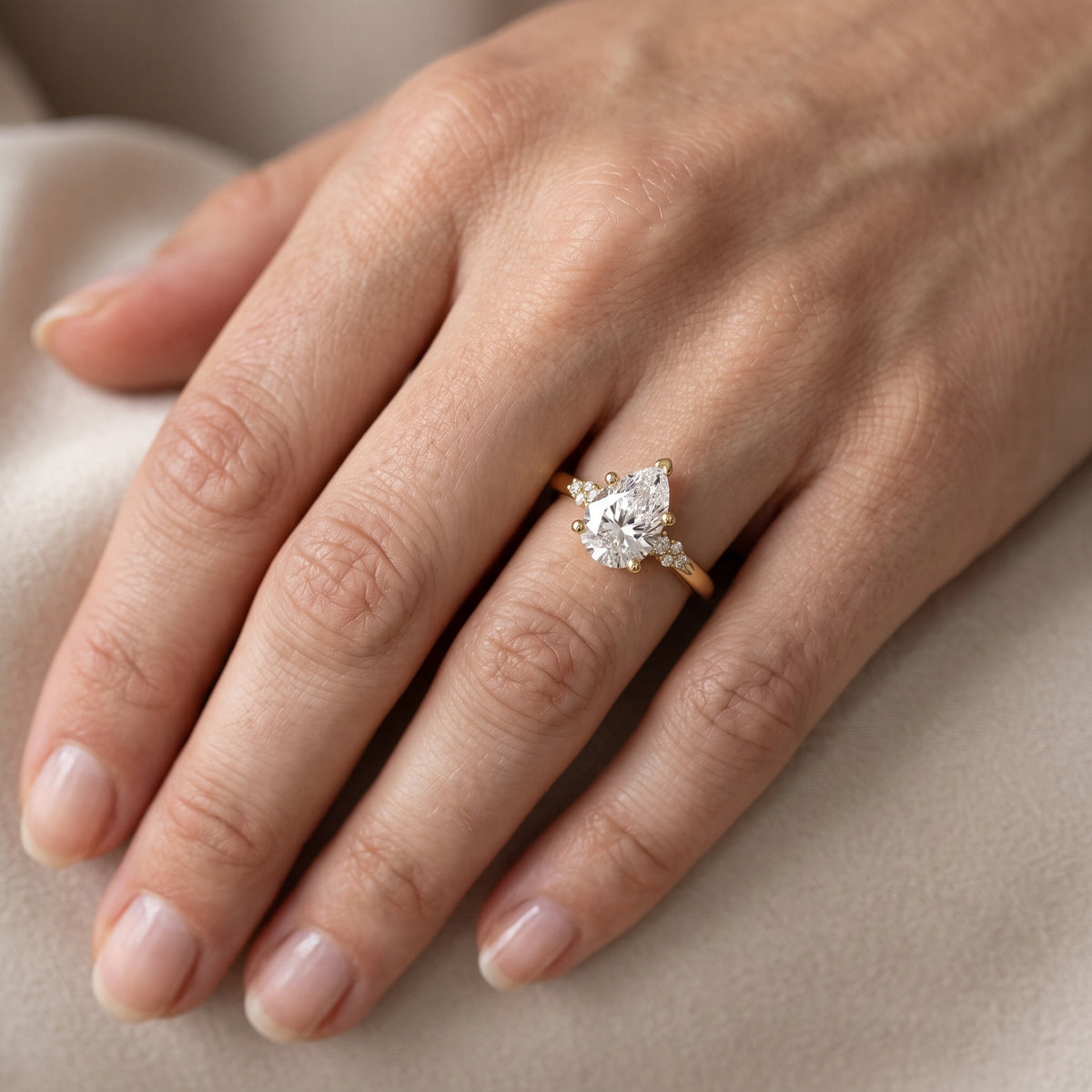 Vail Starburst Cluster Pear Diamond Engagement Ring in White Gold - lifestyle.jpg