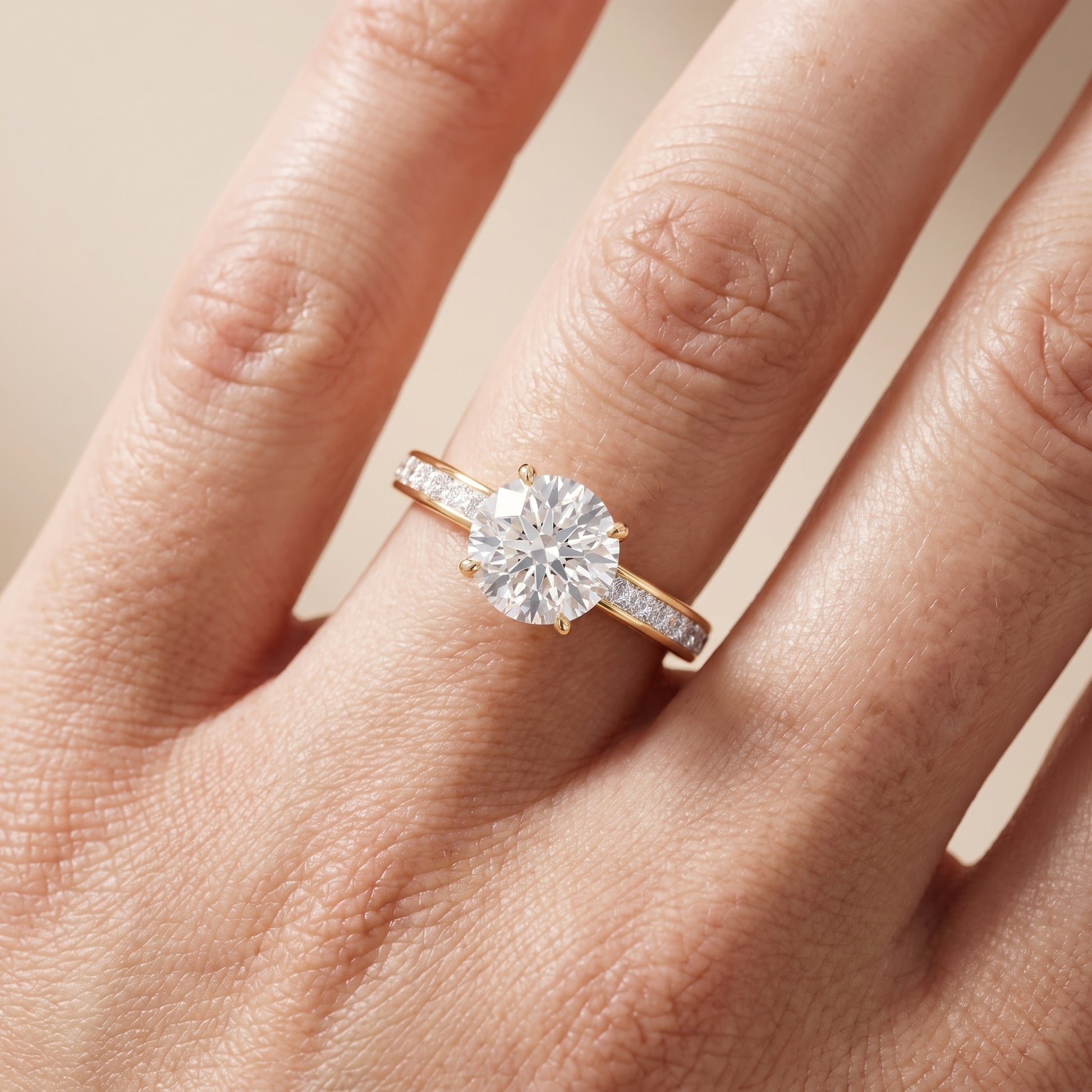 Brielle Channel Set Solitaire Round Diamond Ring in Yellow Gold - lifestyle.jpg