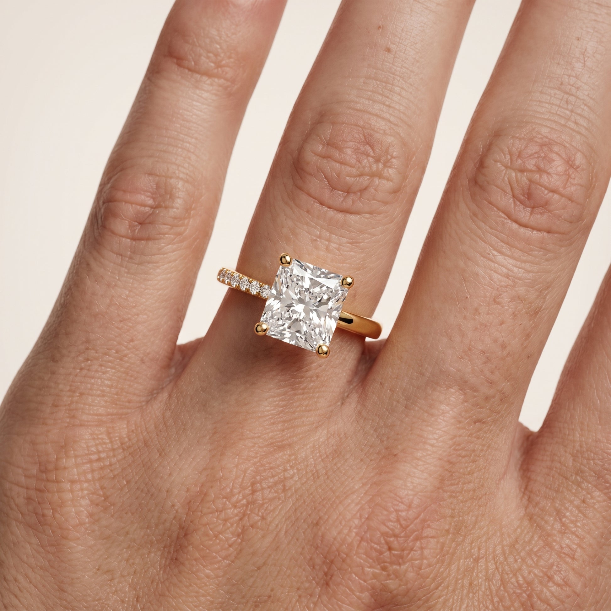 Rosie Solitaire Basket Radiant Diamond Engagement Ring in Yellow Gold - lifestyle.jpg