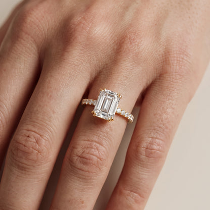 Novara Solitaire Pavé Emerald Diamond Ring in Yellow Gold - lifestyle.jpg