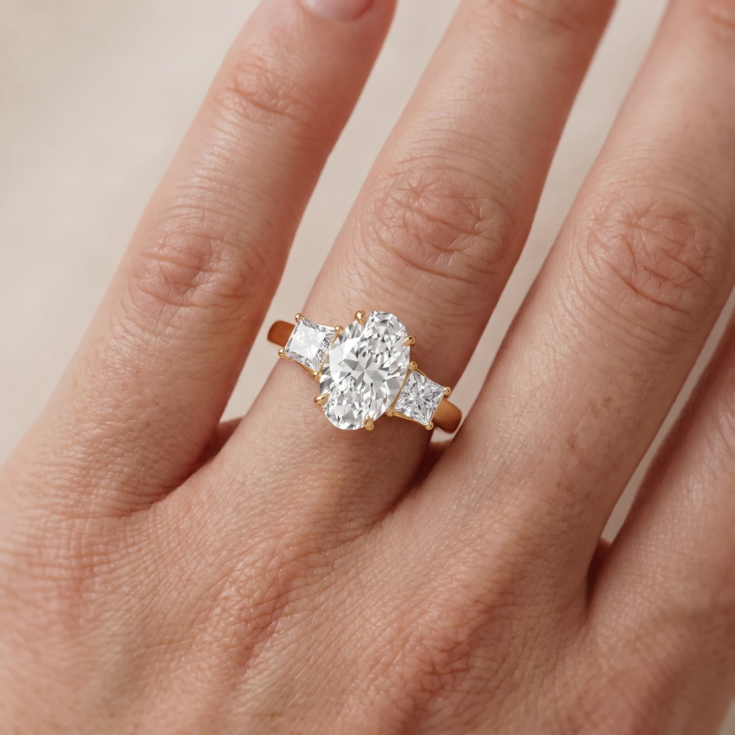 Selena Three-Stone Basket Oval Diamond Ring in Yellow Gold - lifestyle.jpg