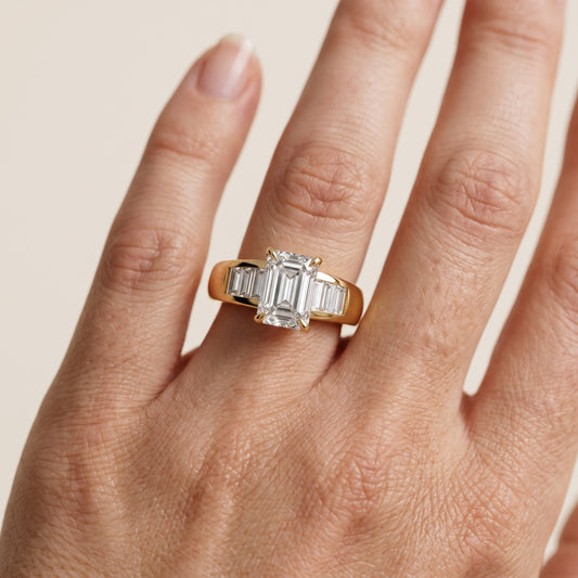 Elsie Channel Set Emerald Diamond Engagement Ring in Yellow Gold - lifestyle.jpg