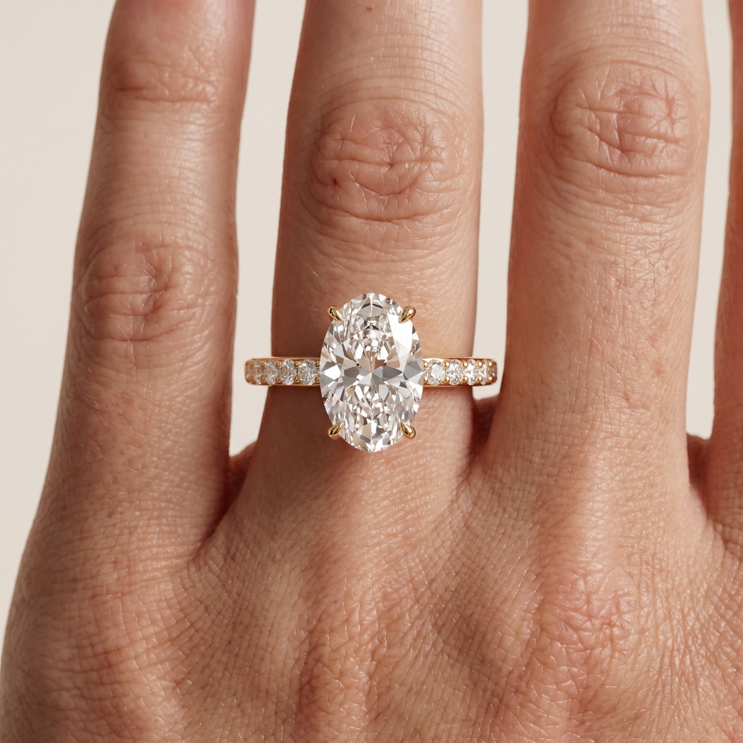Aisha Pavé Solitaire Oval Diamond Engagement Ring in Yellow Gold - lifestyle.jpg