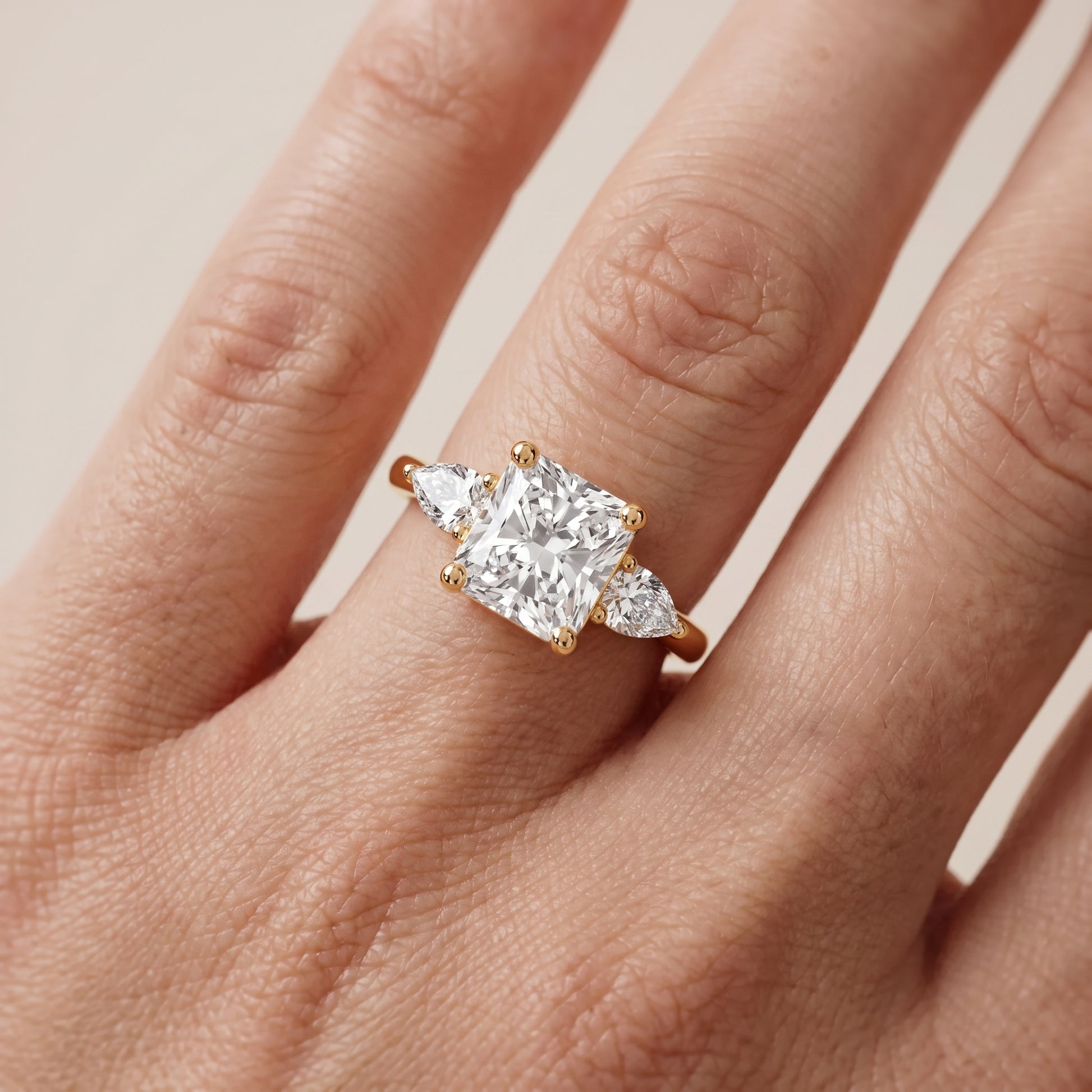 Faye Three-Stone Trellis Radiant Diamond Ring in Yellow Gold - lifestyle.jpg