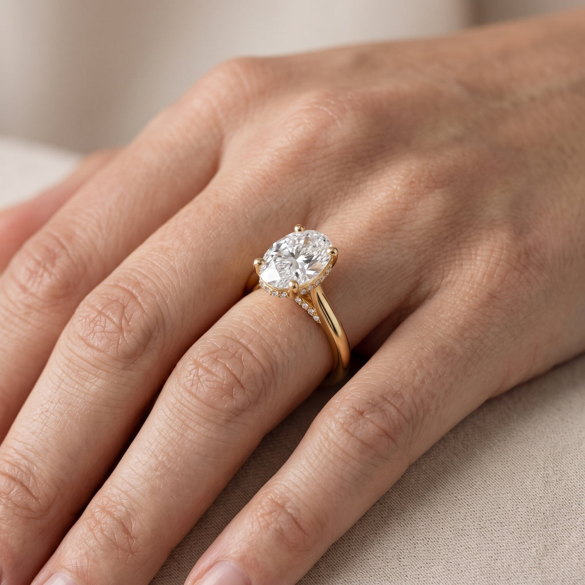 Hyacinth Hidden Halo Cathedral Oval Diamond Engagement Ring in Yellow Gold - lifestyle.jpg