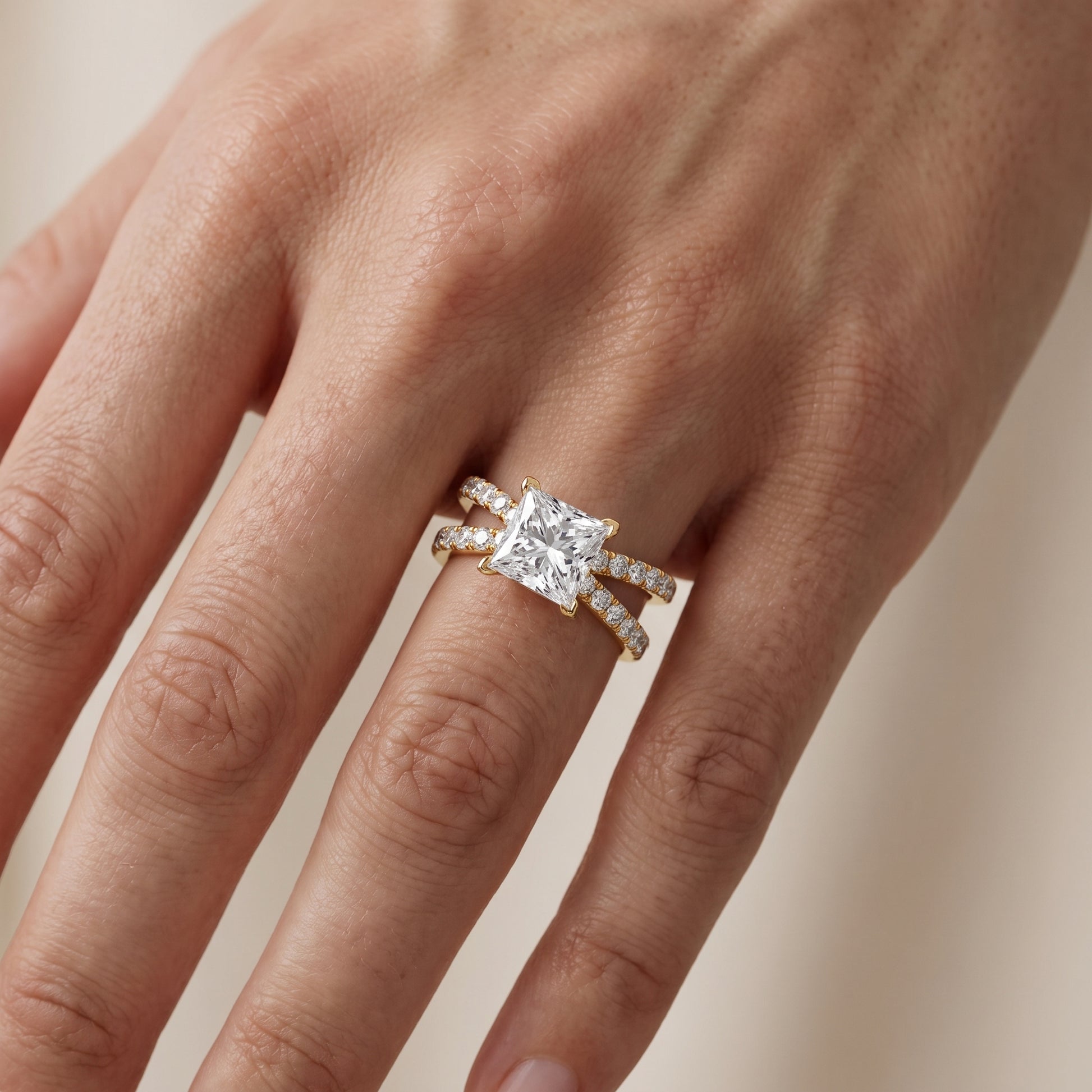 Lior Criss Cross Pavé Princess Diamond Engagement Ring in Yellow Gold - lifestyle.jpg