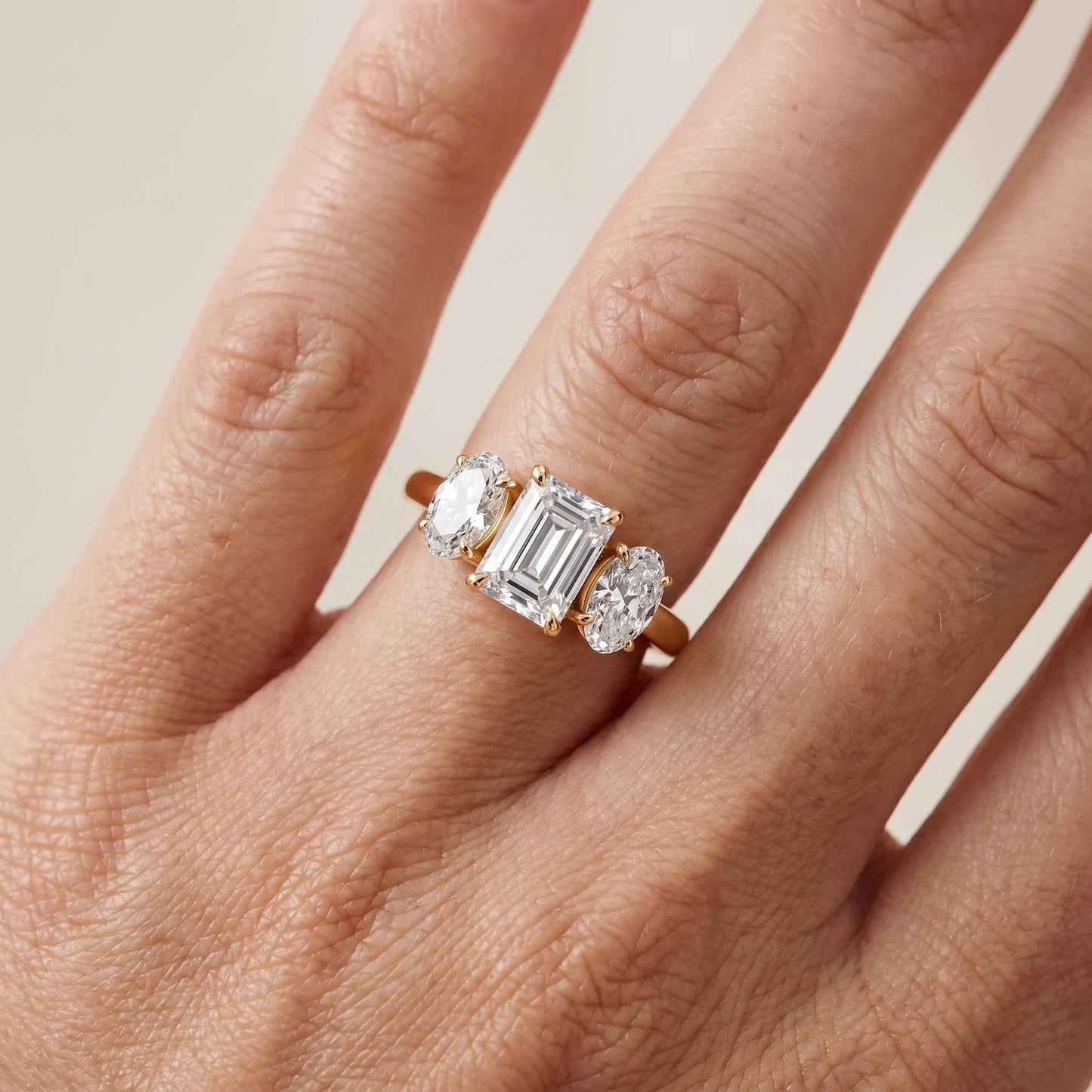 Lila Three-Stone Emerald Diamond Ring in Yellow Gold - lifestyle.jpg