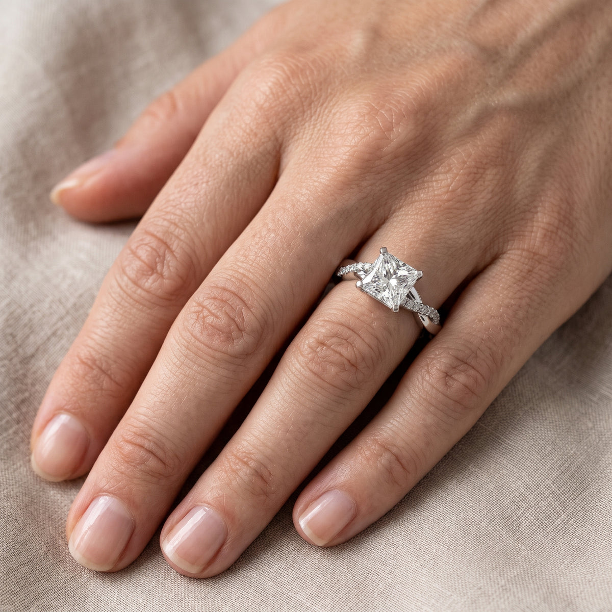 Twisted Side Stone Princess Diamond Engagement Ring in Silver - lifestyle.jpg