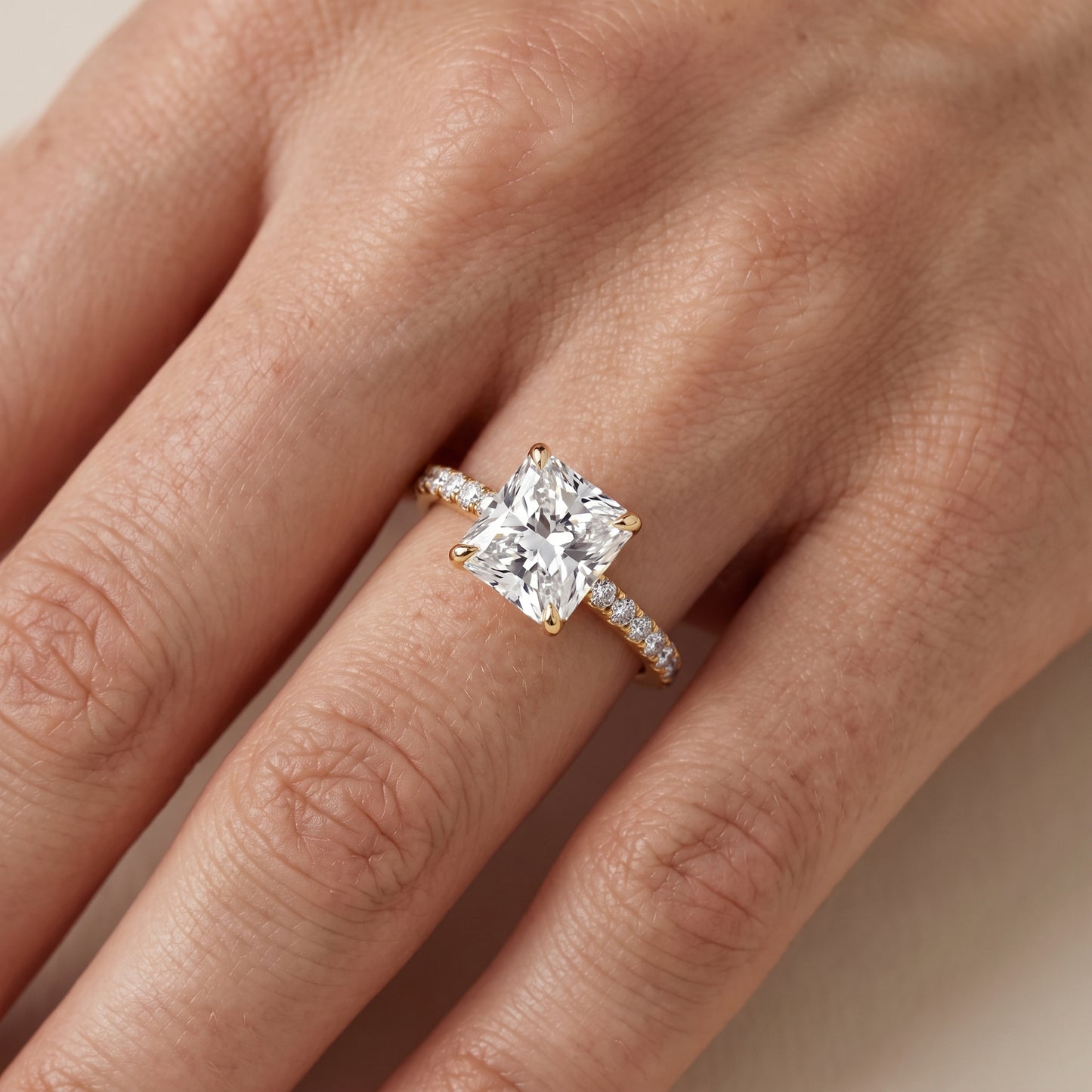 Ione Solitaire Pavé Radiant Diamond Engagement Ring in Yellow Gold - lifestyle.jpg