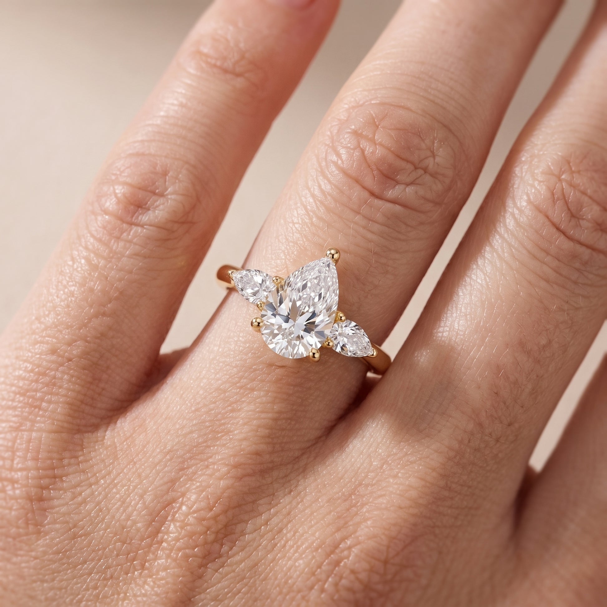 Faye Three-Stone Trellis Pear Diamond Ring in Yellow Gold - lifestyle.jpg